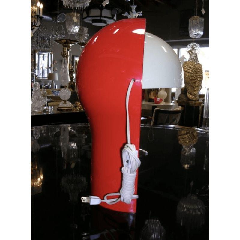 A colorful vintage telegono table lamp, designed by renowned Vico Magistretti for Artemide in 1969. Base is red while the shade is white. Shade.adjusts up and down.
