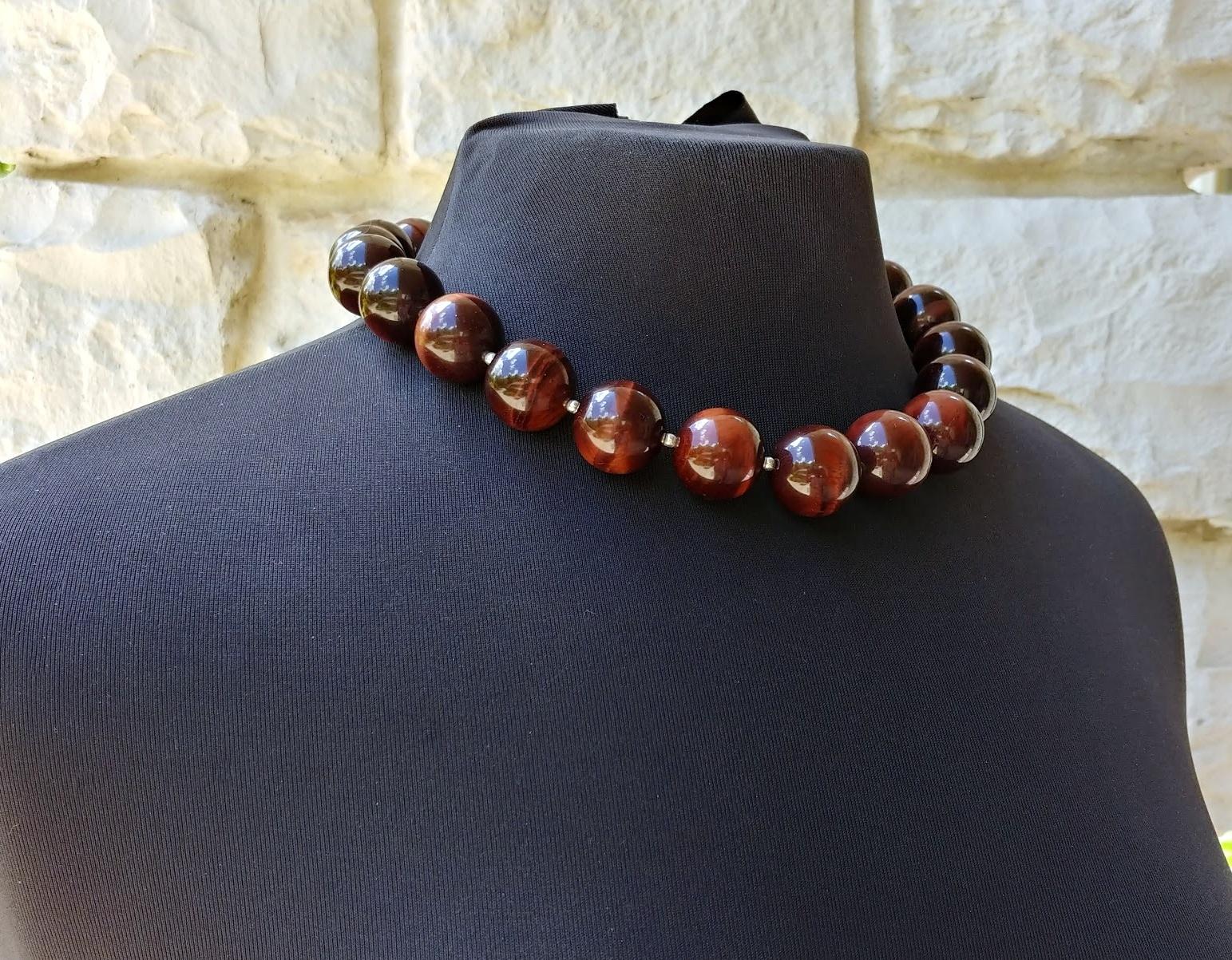 The length of the necklace is 18.5 inches (47 cm). The size of the very high-quality round beads is 20 mm.
The tones of the beads are a wondrous silky chocolate-red, luxurious — gorgeous warm shade of autumn.
The tiger eye was named for the