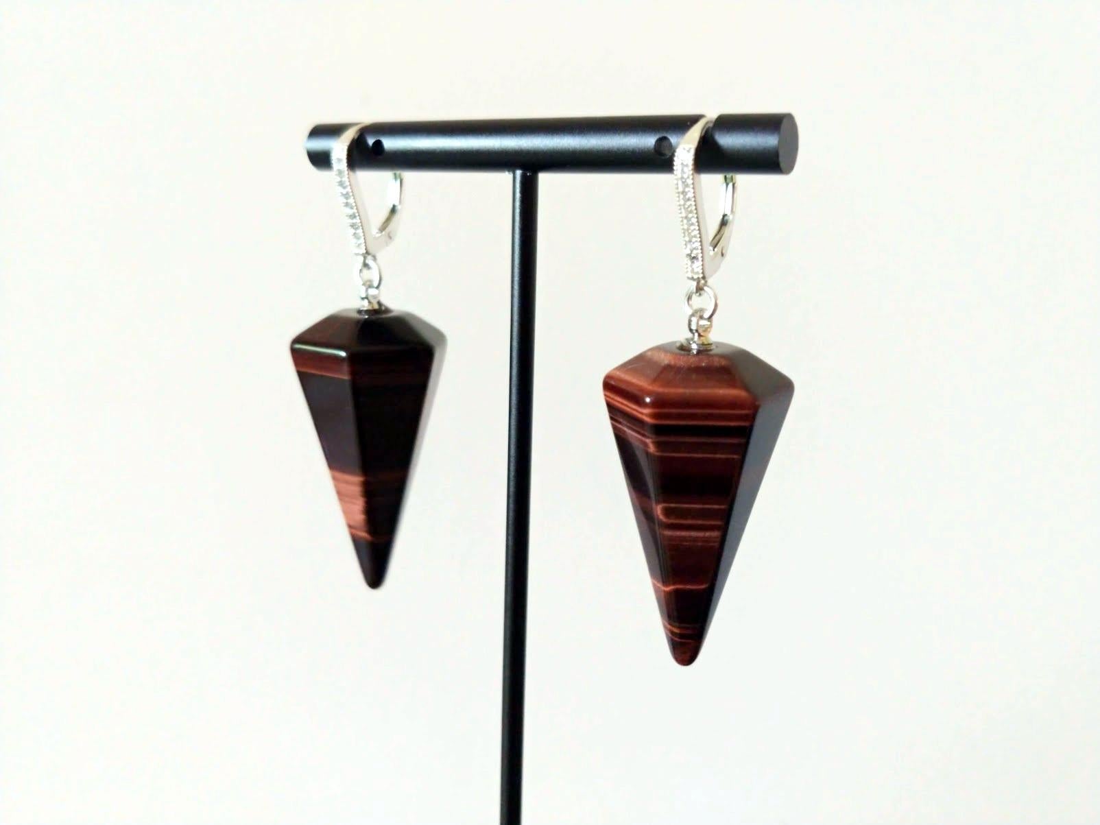 Beautiful one-of-a-kind top-grade natural carved Red Tiger Eye drop earrings. They are made with 38mm x 20mm beads of the highest quality set on sterling silver. All the findings for our jewelry are made specially to order and are of very high