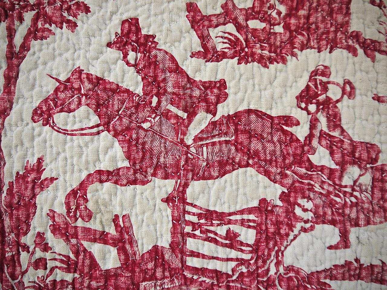 A rarely seen French Toile de Nantes called 'La Chasse du Sanglier' or the Boar Hunt from the Favre Petotpierre et Cie factory. There are scenes with falcons, horses jumping and running dogs and some ladies and gentleman. A soft raspberry red color,