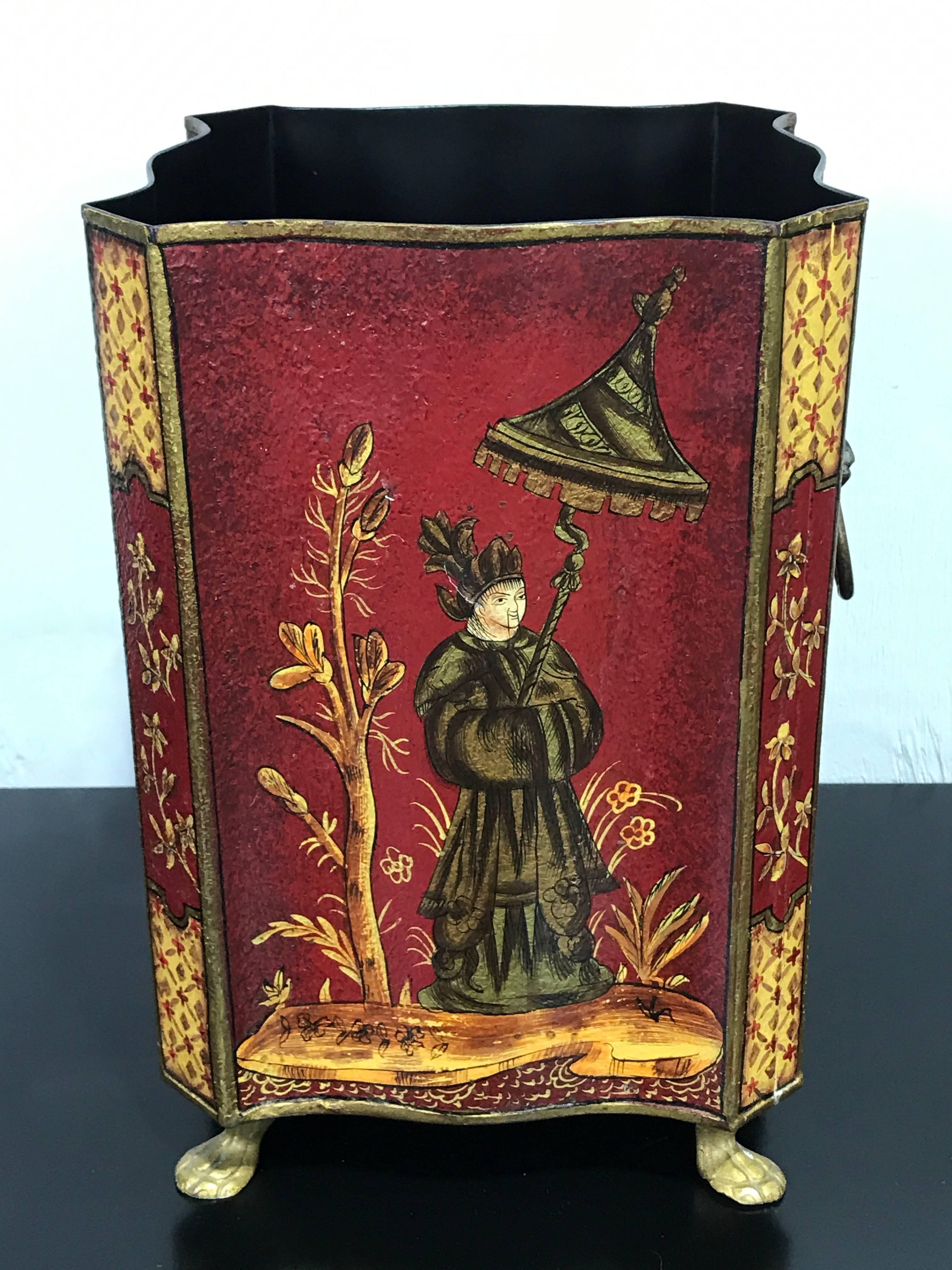 Red tole chinoiserie wastepaper or trash can, with fine gilt decoration with ring handles and paw feet. The interior measures 7 x 7 x 10.5