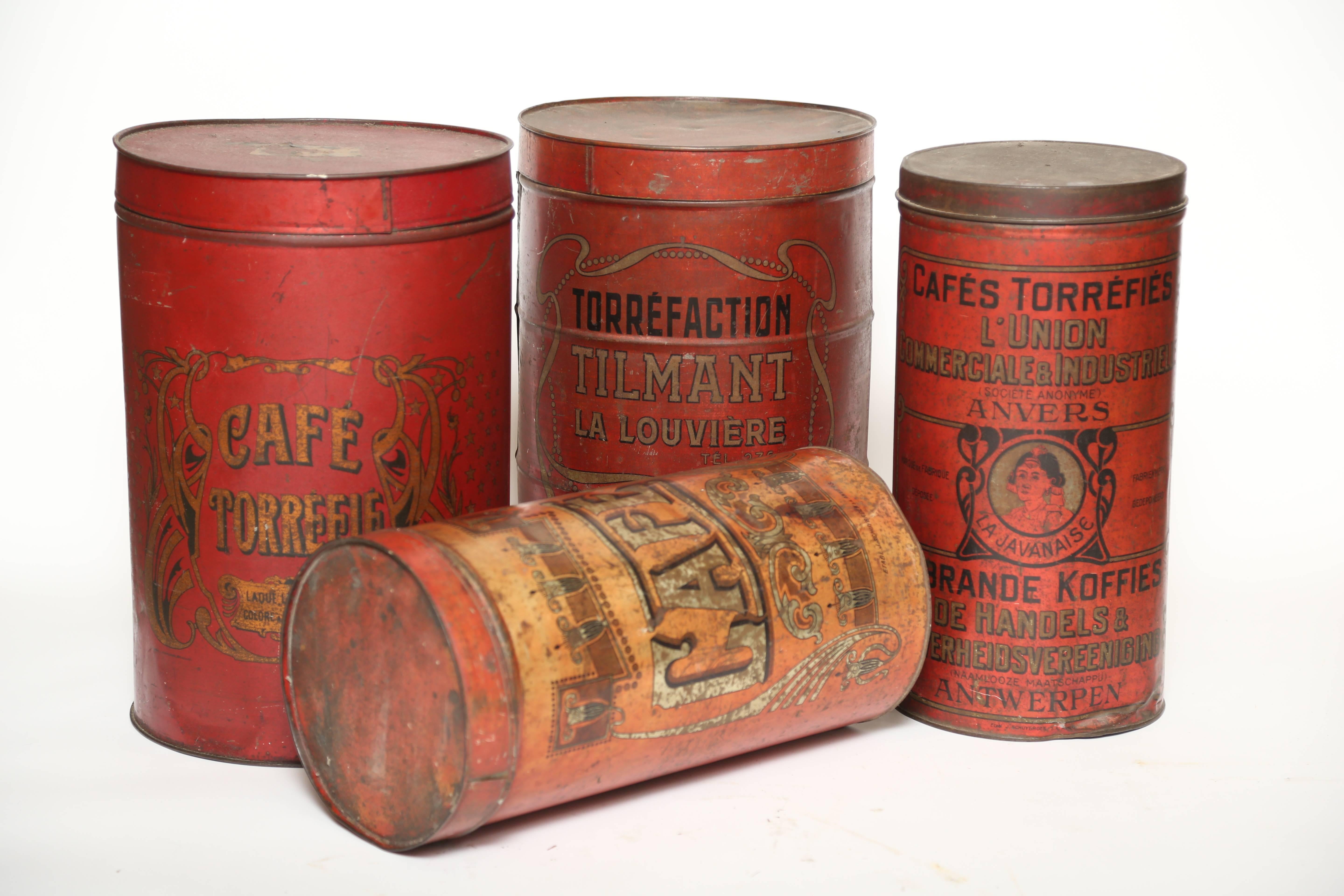 A collection of red tôle coffee tins from Belgium with Art Nouveau designs.  How wonderful in a country kitchen.
Measurements: The larger tins are 18.5