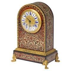 Reloj de sobremesa o de chimenea de carey rojo y Boulle