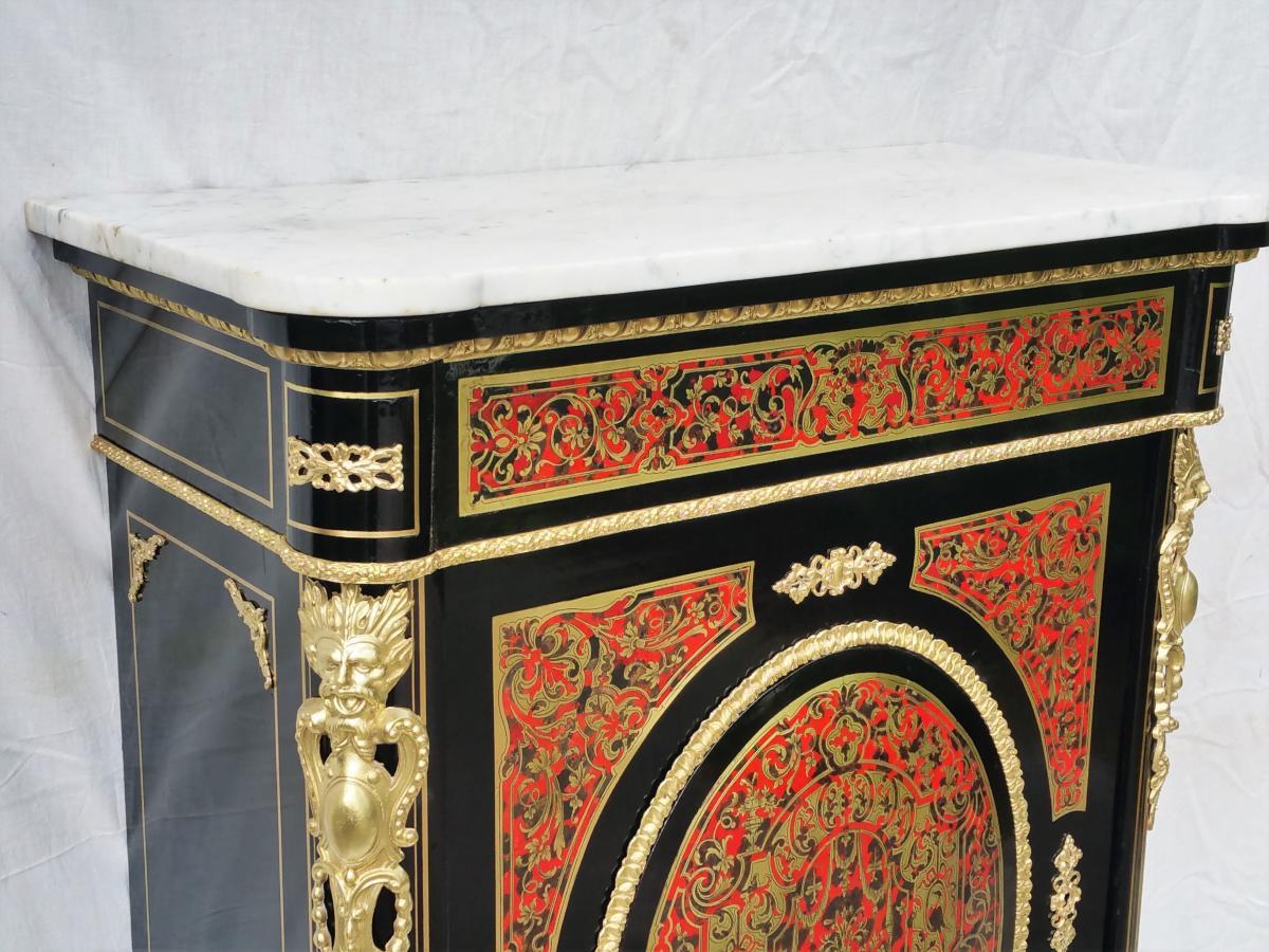 Gorgeous cabinet in blackened wood veneer and Boulle style inlay with brass and red tortoiseshell, and gilt bronze ornaments, Carrara marble, mahogany interior with 2 shelves, key available.
France Napoleon III, circa 1870. It has been totally