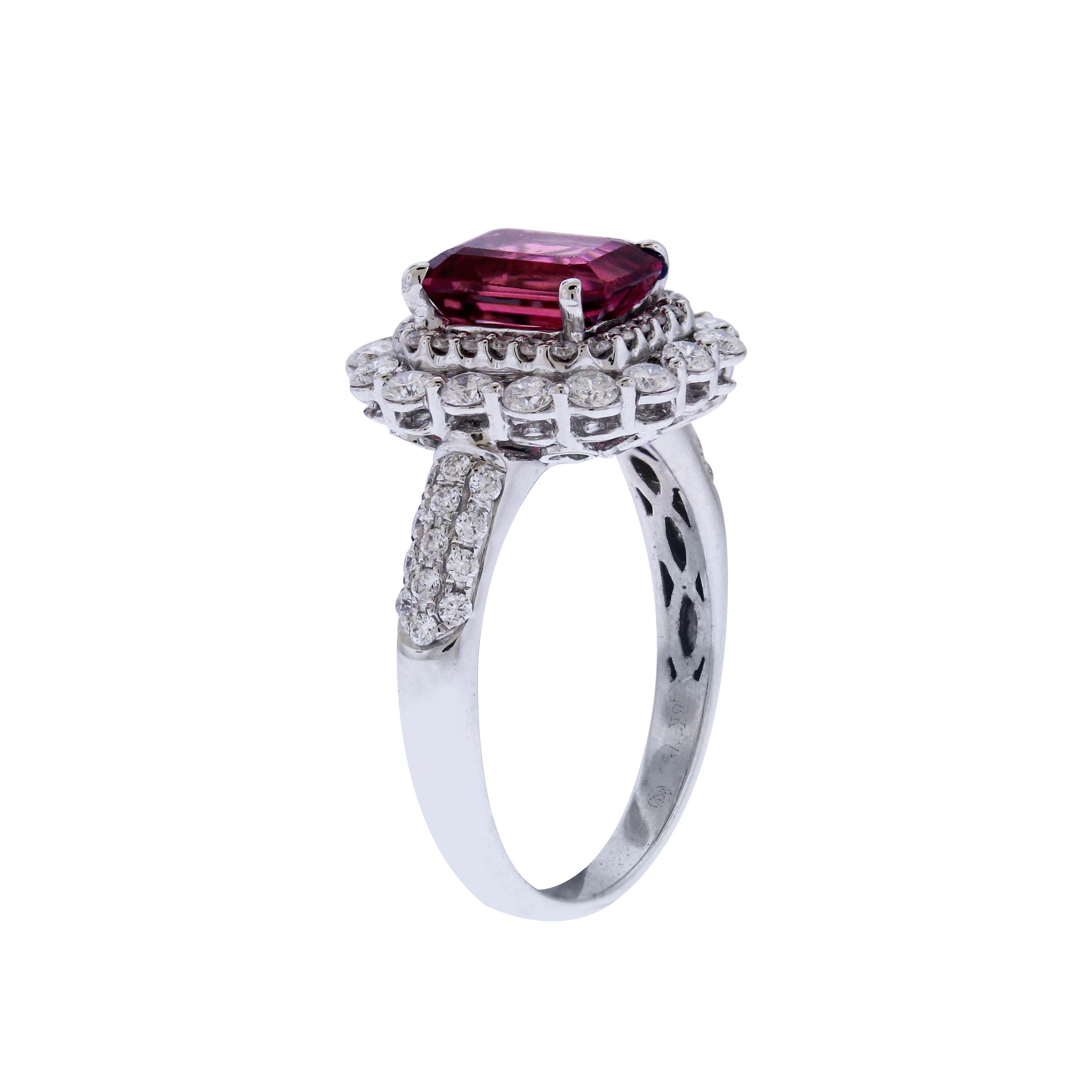 18K White Gold and Diamond Cocktail Ring with Red Tourmaline center

Tournaline is apprx. 3 carats, 8mm x 6mm dimmensions

0.75 carat diamonds are set on the band and surrounding the Tourmaline

Ring face is 0.55 inch by 0.5 inch. 3mm band