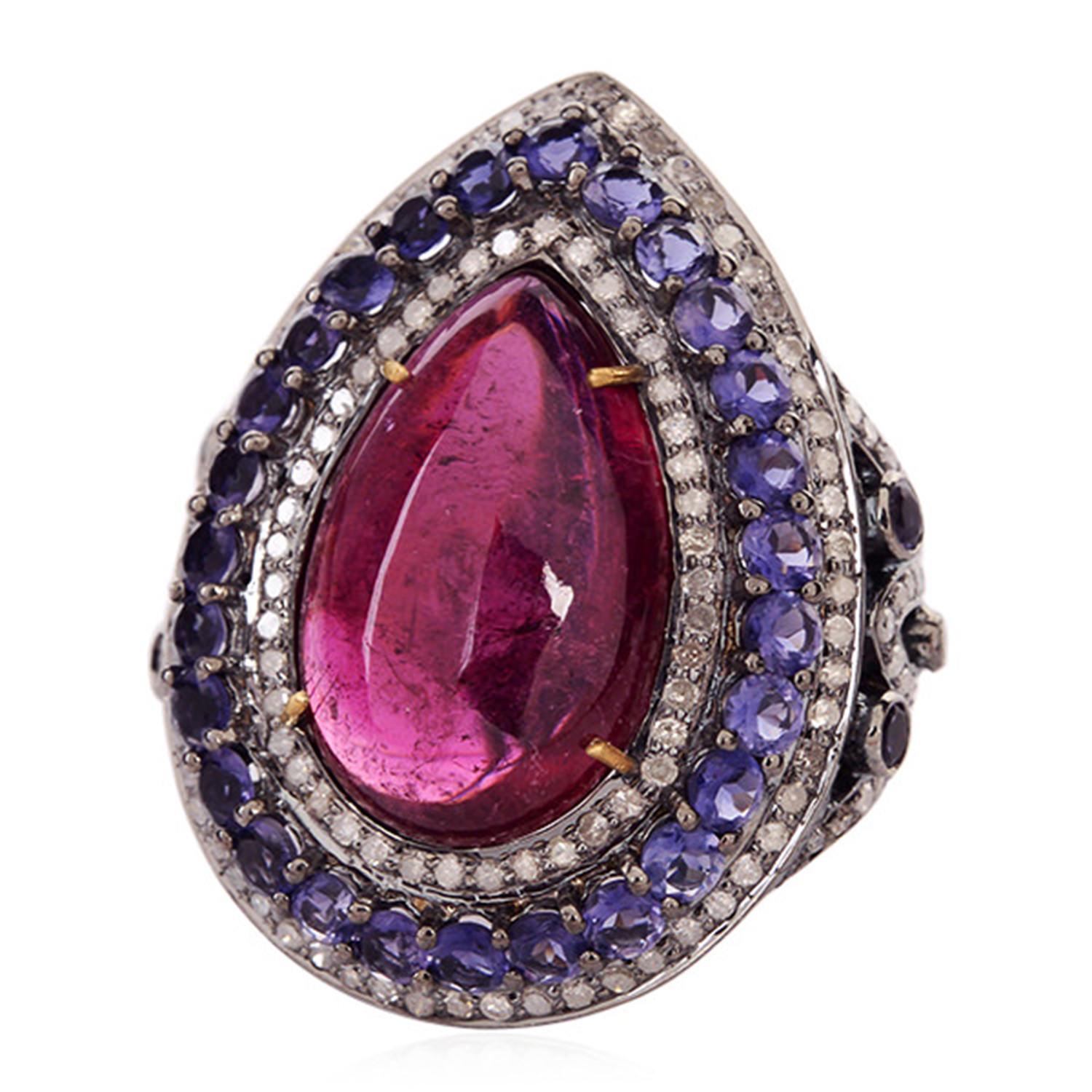 Designer pear shape cabochon red tourmaline diamond Iolite Ring in gold and silver is truly a cocktail ring.

Ring Size: 7 ( Can be sized for a cost )

18KT: 2.63gms
Diamond: 2.05cts
SiIver: 9.36gms
Iolite: 3.25cts
Red Tourmaline: 18.4cts
