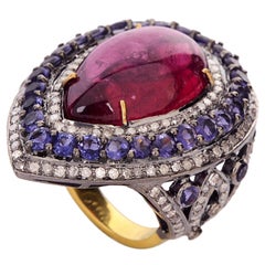 Bague en or et argent 18 carats avec tourmaline rouge, diamant et iolite