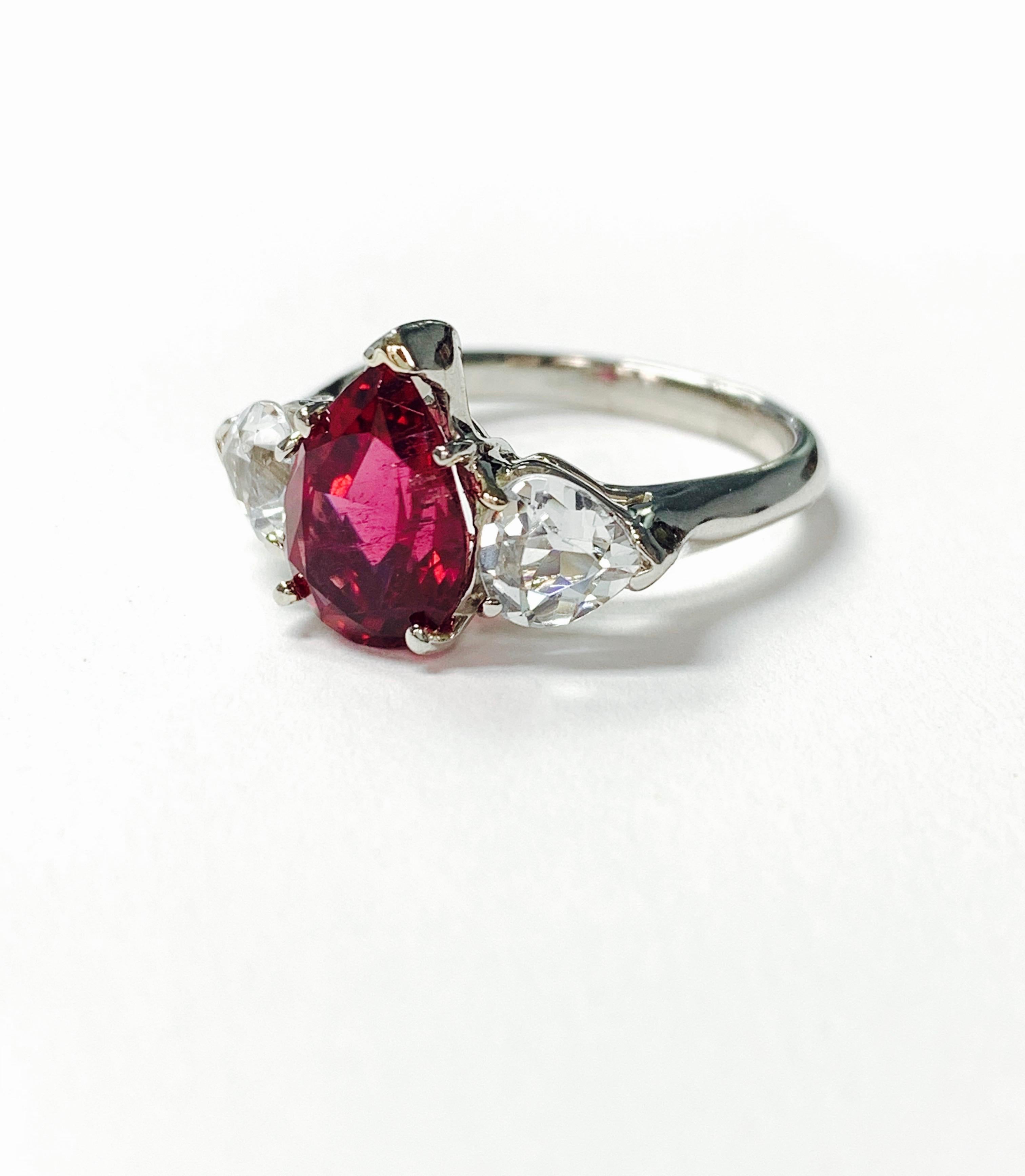 Red tourmaline pear shape and white sapphire ring hand made in platinum . 
The details are as follows : 
Pear shape tourmaline weight : 2.5 carat 
White sapphire weight : 1.5 carat 
Metal ; platinum 
