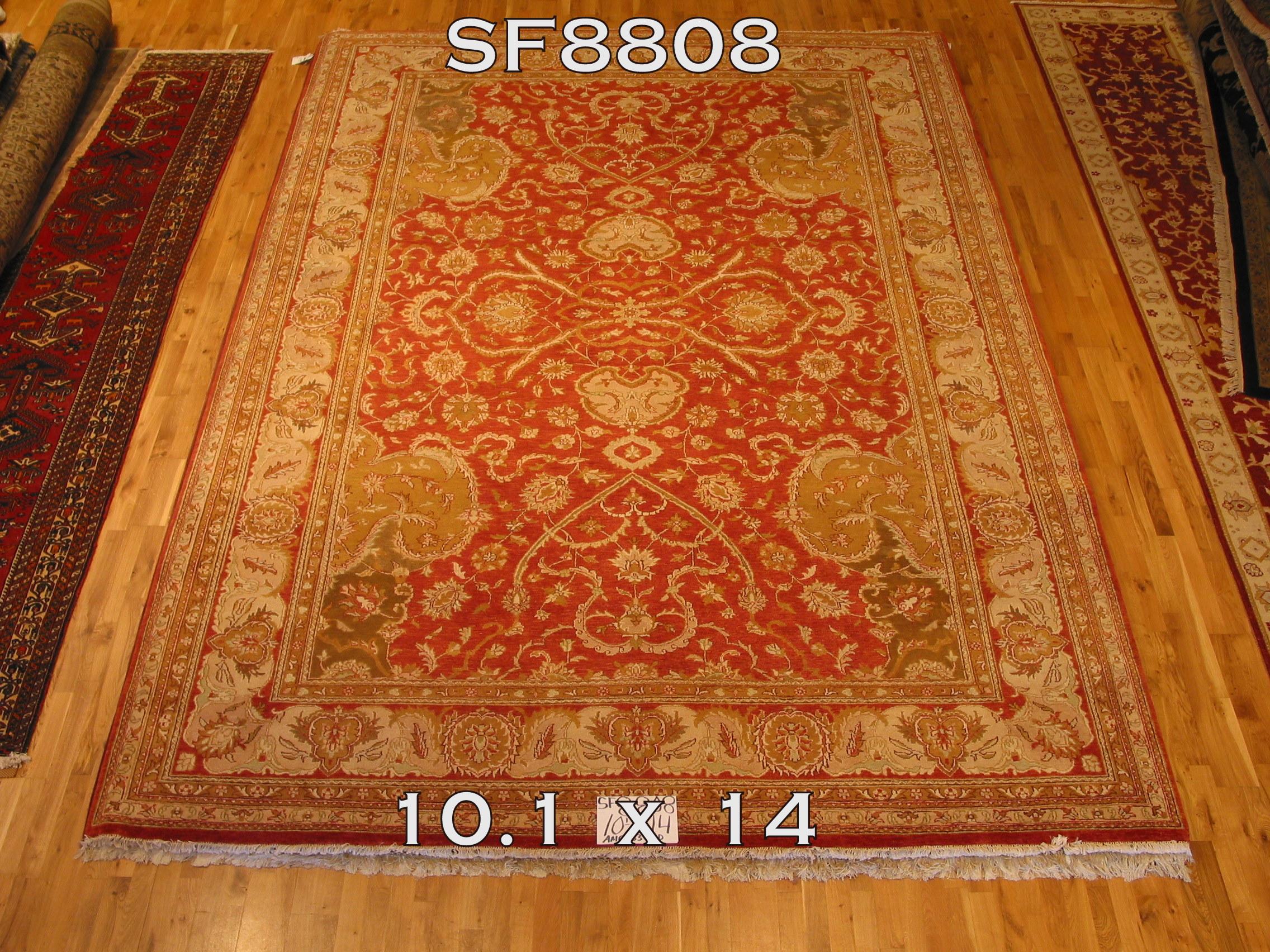 The intricate design of the bold red center panel gives this traditional style area rug its distinctive look. A succession of floral ribbons frame. An elegant and exciting look for the dining or living room.

Hand knotted wool. Handmade in India