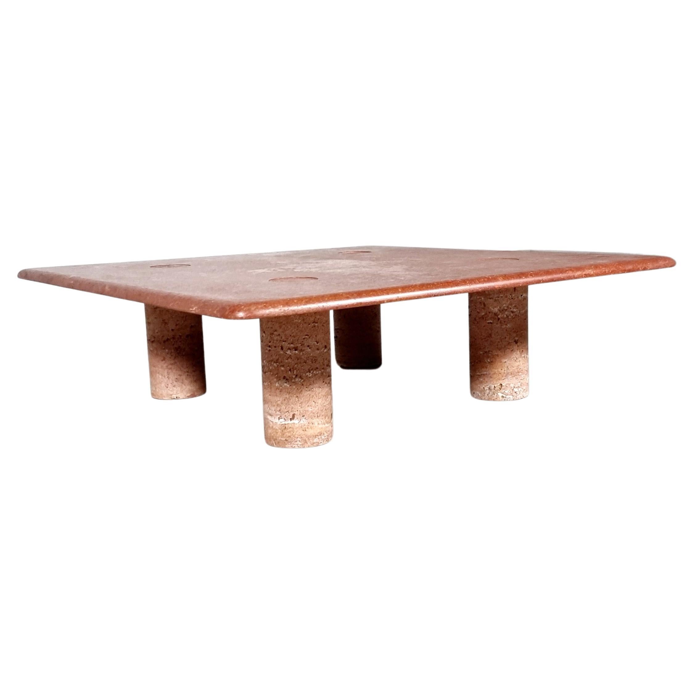 A Timeless red travertine coffee table with interlocking legs that was designed by Angelo Mangiarotti for Up&Up in the 1970s.

The table features no joints or clamps and is architectural in its structure. The table rests on four cone-shaped legs.