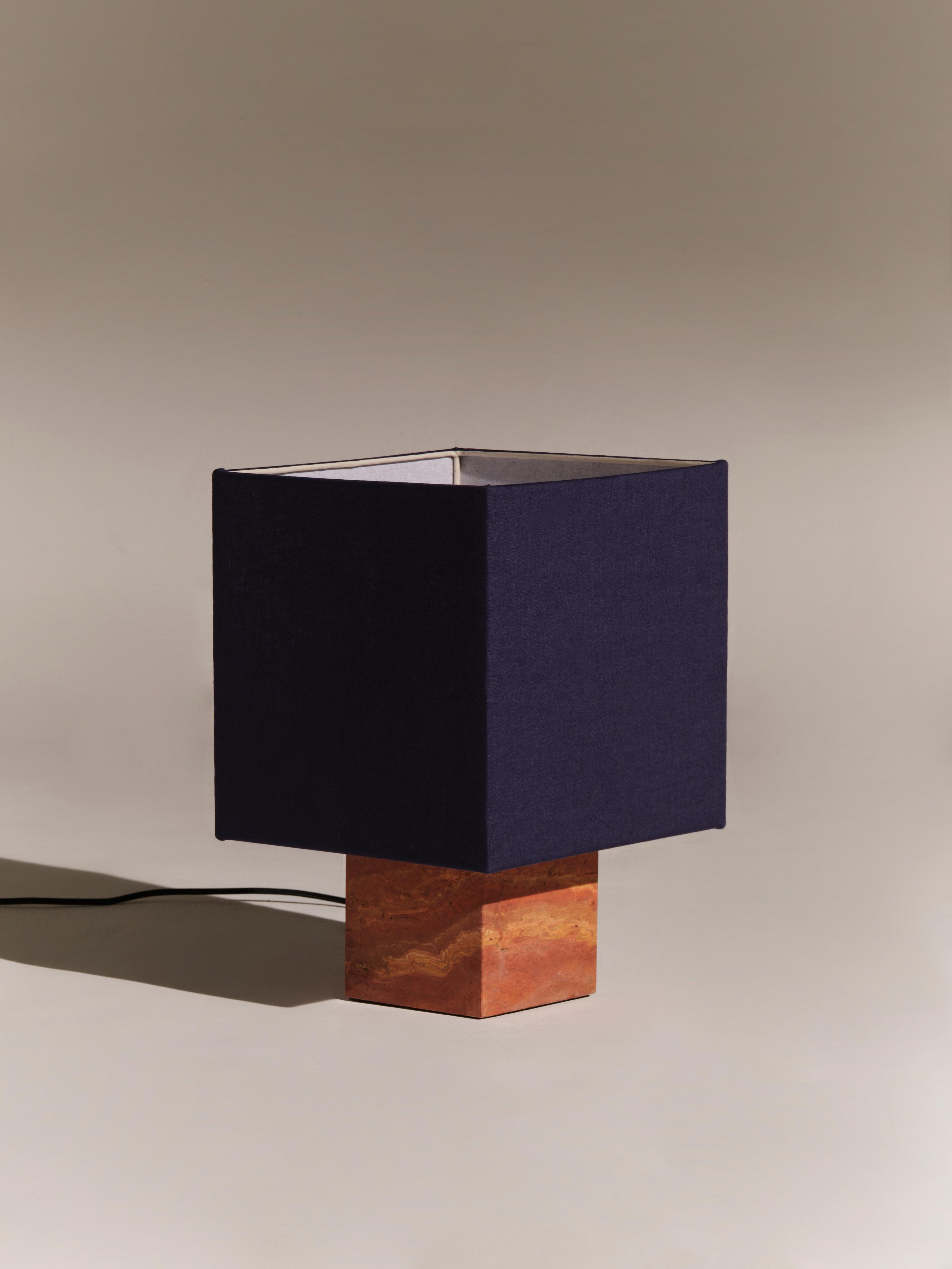 Red Travertine Small Roma 1 Square Table Lamp by NASSI
Dimensions: W 30 x D 30 x H 44 cm. 
Materials: Fine cotton lining, pure linen fabric in blue. 
Base: Red Travertine, nickel plated brass. 
Weight: 9 kg

Also available in 4 colors (white,
