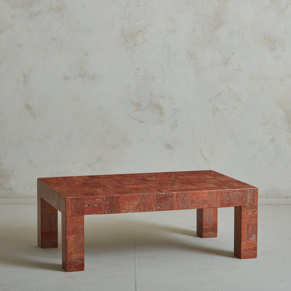 A vintage Italian coffee table featuring a tessellated finish in Red Travertine with gorgeous veining. This stone has a range of red, coral and taupe hues, which are emphasized by the cross-grain tessellation and angular lines. Sourced in Italy,