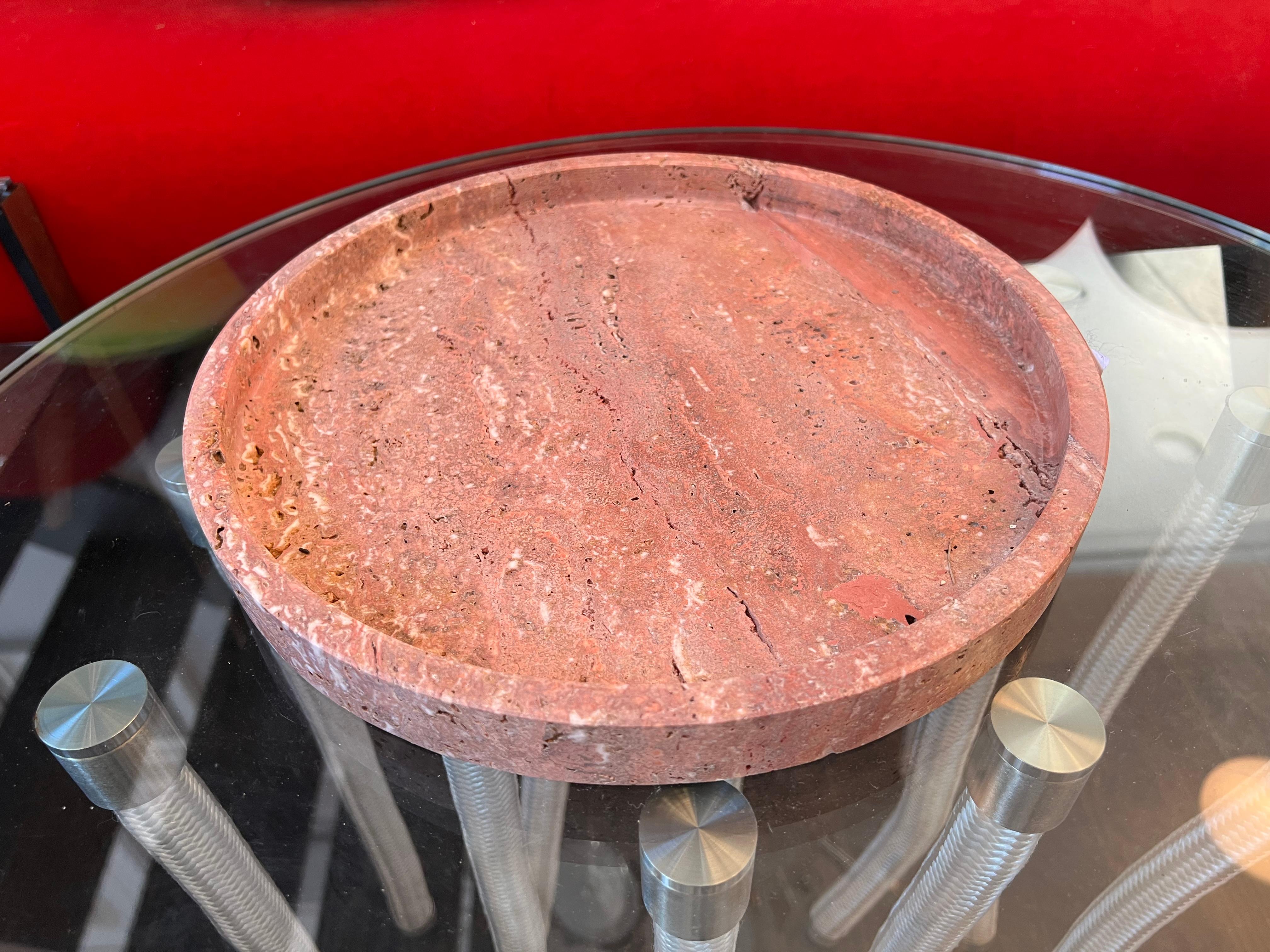 Red round travertine tray by Le Lampade.
Made in Italy 
This item can be also custom made.