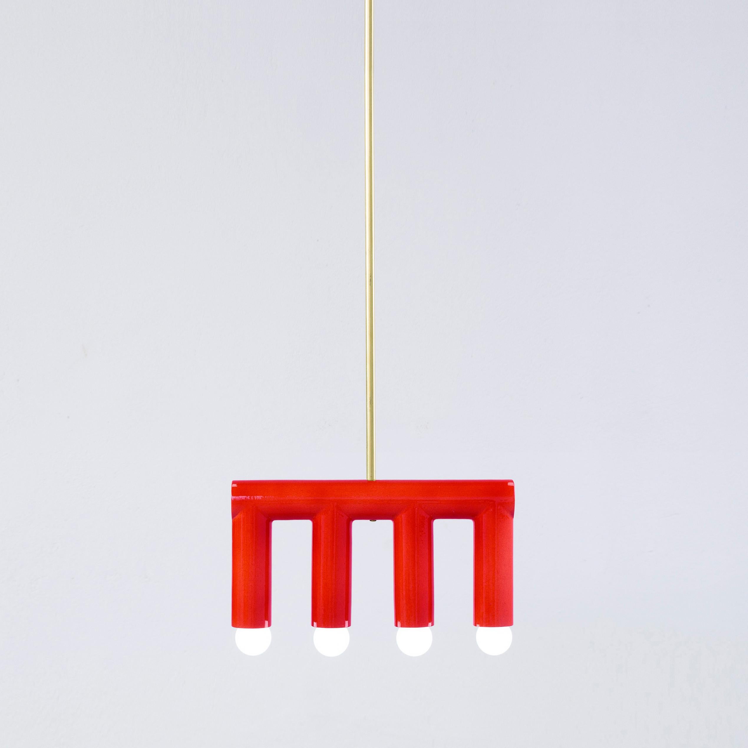 Red TRN B3 pendant lamp by Pani Jurek
Dimensions: D 5 x W 35 x H 18 cm 
Material: Hand glazed ceramic and brass.
Available in other colors.
Lamps from the TRN collection hang on a metal tube, not on a cable. This allows the lamp to be mounted in a