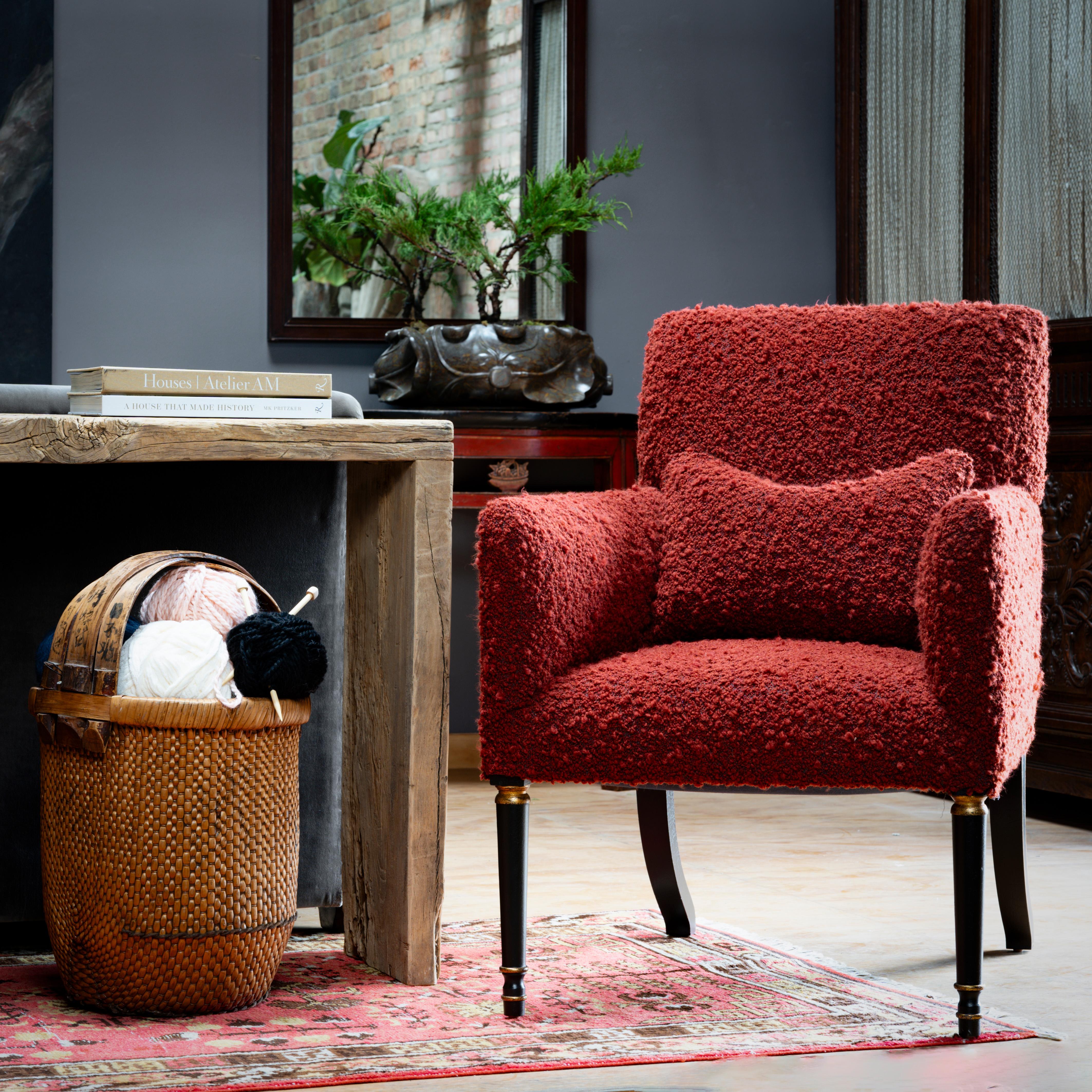 This chic and modern armchair by furniture manufacturer Dessin Fournir combines sharp lines with soft, cushioned upholstery. From Old World baroque to cutting-edge contemporary, Dessin Fournir luxury furniture celebrates timeless craftsmanship. The