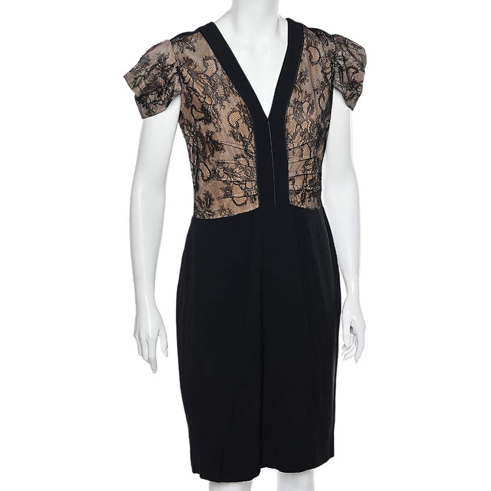 Overlaid with intricate fabrics into a stunning shape, this midi dress from RED Valentino will add an element of luxury and sophistication to your ensemble. It is stitched using black lace and crepe fabric and shows paneled detailing. It is provided
