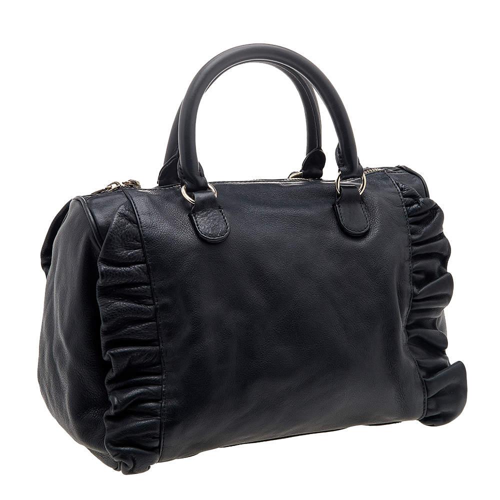 Head to work in style with this elegant handbag. Skillfully made from leather and held by top handles, it can easily hold more than just essentials. Lined with fabric, the interior is as durable as the exterior. This ED Valentino creation is perfect