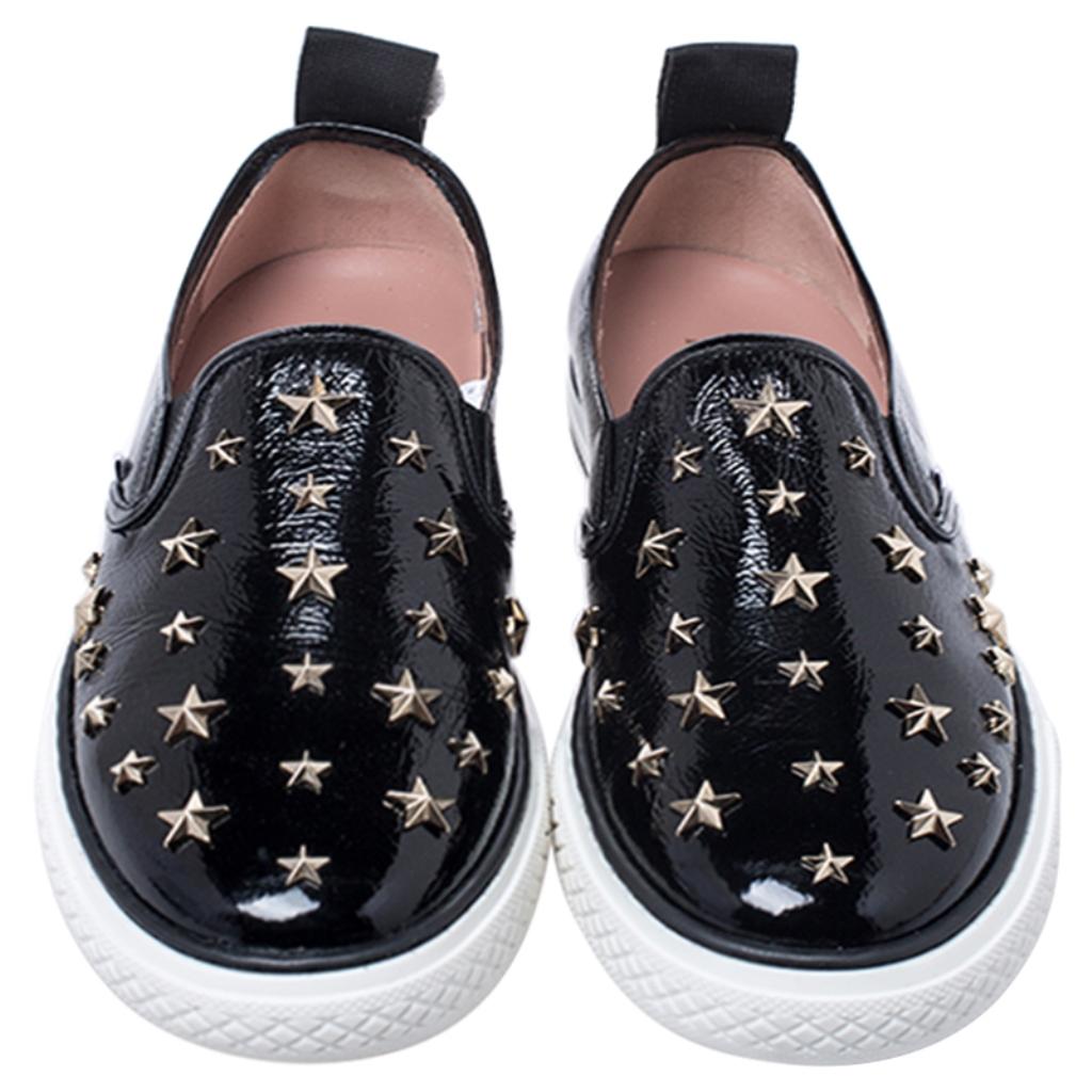 Lightweight and versatile, these exquisite and intriguing sneakers from the house of Red Valentino have been meticulously crafted in a black patent leather body. They come detailed with star embellishments on the vamps and fitted with comfortable