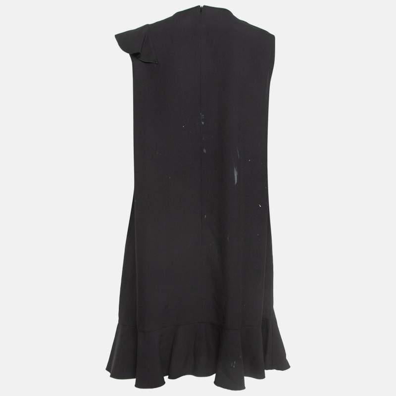 This RED Valentino dress is a chic and stylish garment that exudes elegance and sophistication. With its sleek design flattering silhouette and high quality craftsmanship this dress is perfect for any special occasion or evening event ensuring you