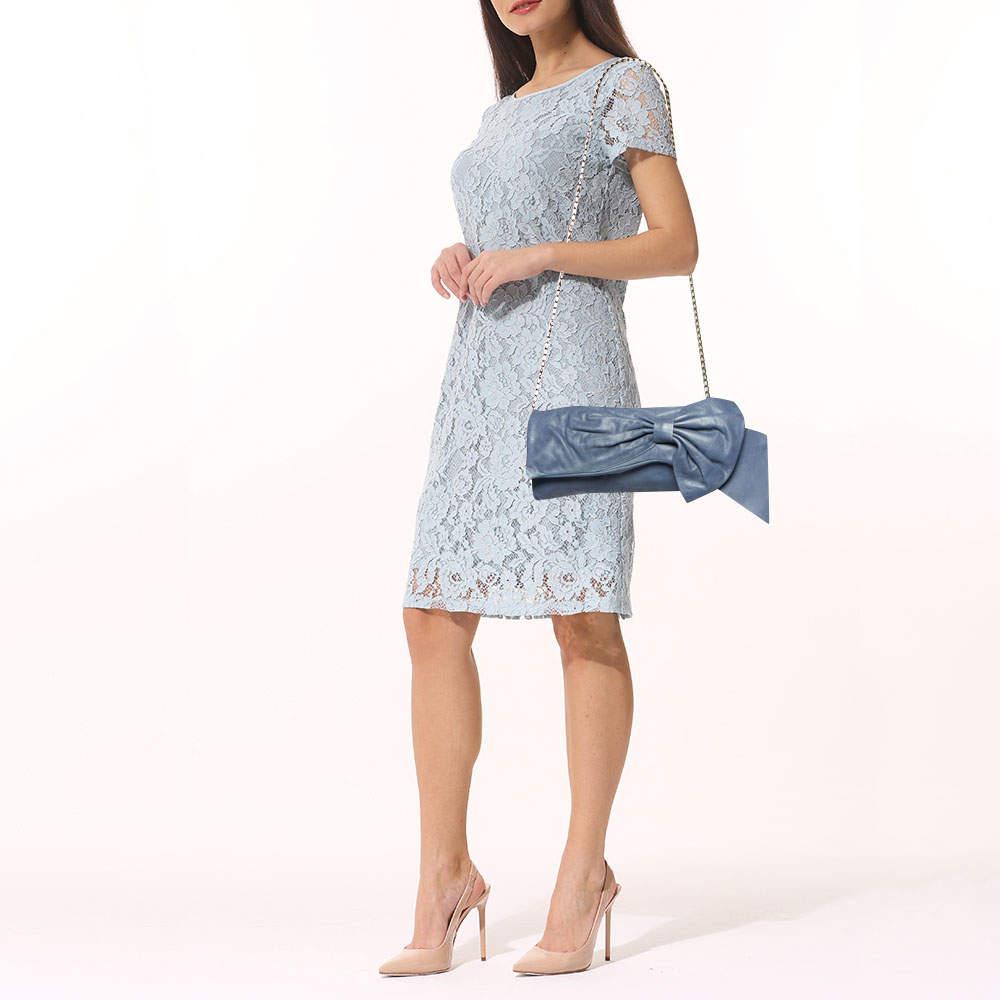 This RED Valentino clutch is just the right accessory to compliment your chic ensemble. It comes crafted in quality material featuring a well-sized interior that can comfortably hold all your little essentials.