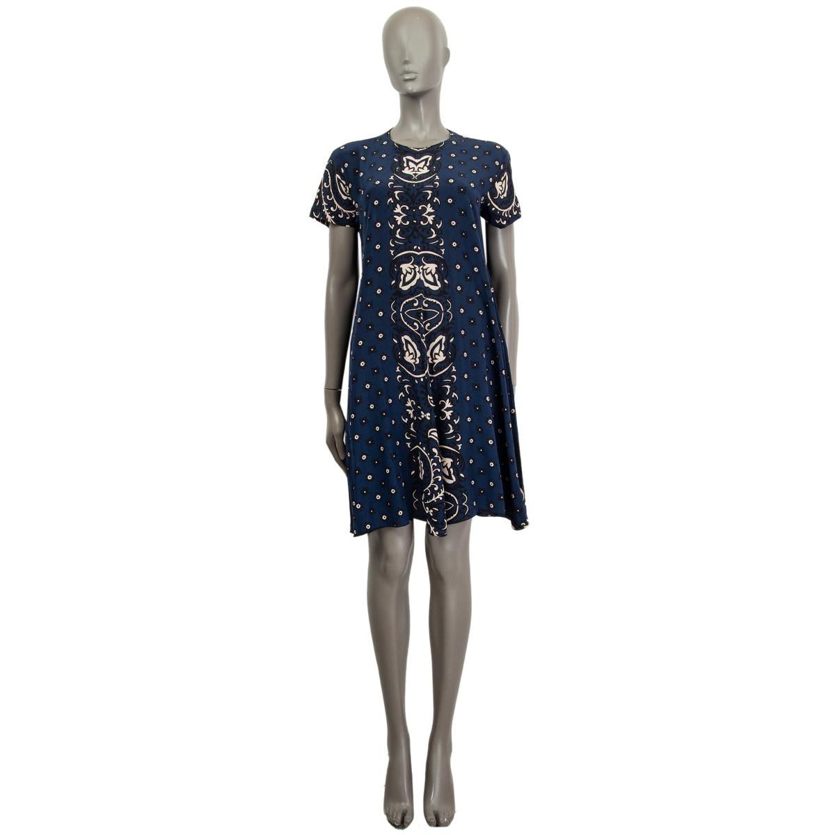 100% authentic RED by Valentino short sleeve bandana print dress in midnight blue, black and taupe silk (100%) with a round neck  and side slit pockets. Closes on the back with a keyhole button. Unlined. Has been worn and is in excellent condition.