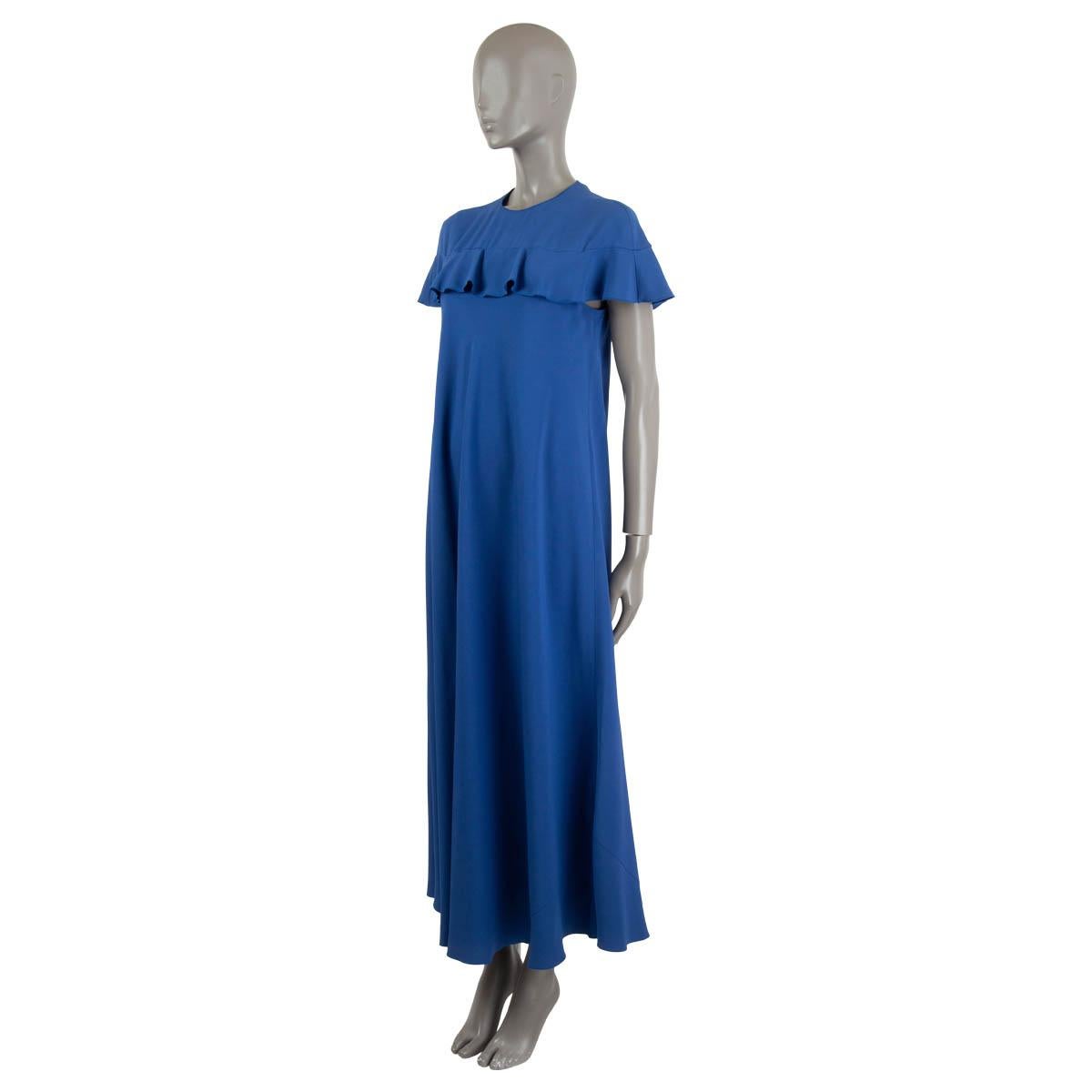 100% authentic RED Valentino maxi dress in royal blue crepe de chine silk (100%). Features a flounce hem line and ruffels across the front and back, creating a cape inspired silhouette. Closes with a concealed zipper in the back. Unlined. Has been