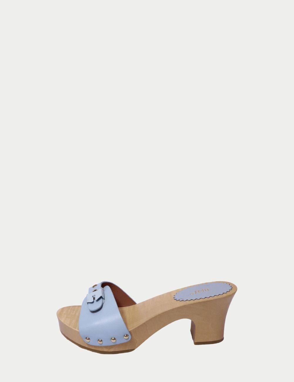 Red Valentino Powder Blue Leather Buckle Clogs with Wooden Heel

Bring retro charm and designer flair to your wardrobe with these Red Valentino clogs. Crafted with a smooth powder blue leather upper, these slip-on clogs feature a silver-tone buckle
