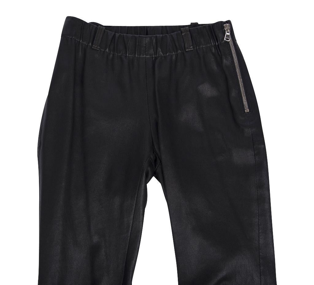 Guaranteed authentic Red Valentino black lambskin pant accentuated with bold silver zippers.
This seasons MUST HAVE!
Flat front, straight leg pant.
Elastic waist.
4 belt loops.
Stitch detail 
Fabric is lambskin. No size tag.
final sale

SIZE fits