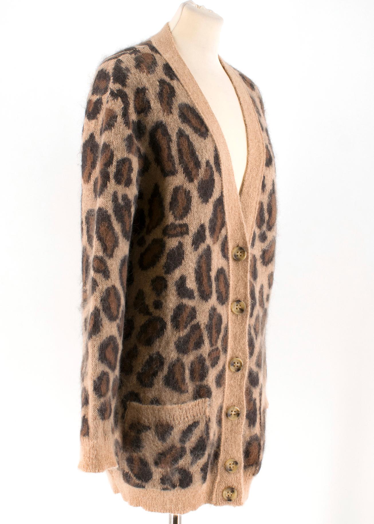 Red Valentino Leopard Print Knit Cardigan 

- Brown leopard print cardigan 
- Mohair Blend 
- V-neck, long sleeved 
- Buttoned center front 
- Front jet pockets 
- Ribbed edges 
- 67% Mohair, 28% Polyamide, 5% Wool 

Please note, these items are