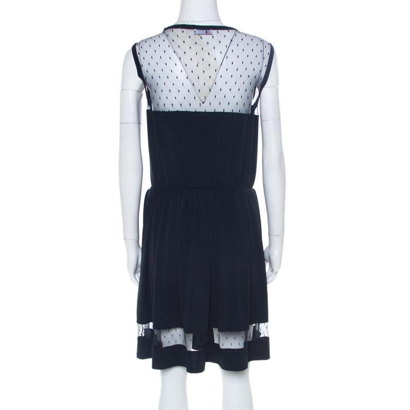Elegant and graceful, this RED Valentino dress is a true example of the brand's tasteful designs. The navy blue sleeveless creation is made of a blend of fabrics and features a pleated bottom silhouette. It flaunts a sheer lace panel detailing on