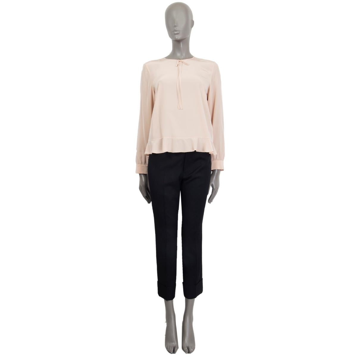 100% authentic R.E.D. Valentino long-sleeve round-neck blouse in nude silk (100%) with little bow detail and ruffle trim. Has been worn and is in excellent condition. 

Tag Size	42
Size	M
Shoulder Width	41cm (16in)
Bust To	96cm (37.4in)
Waist