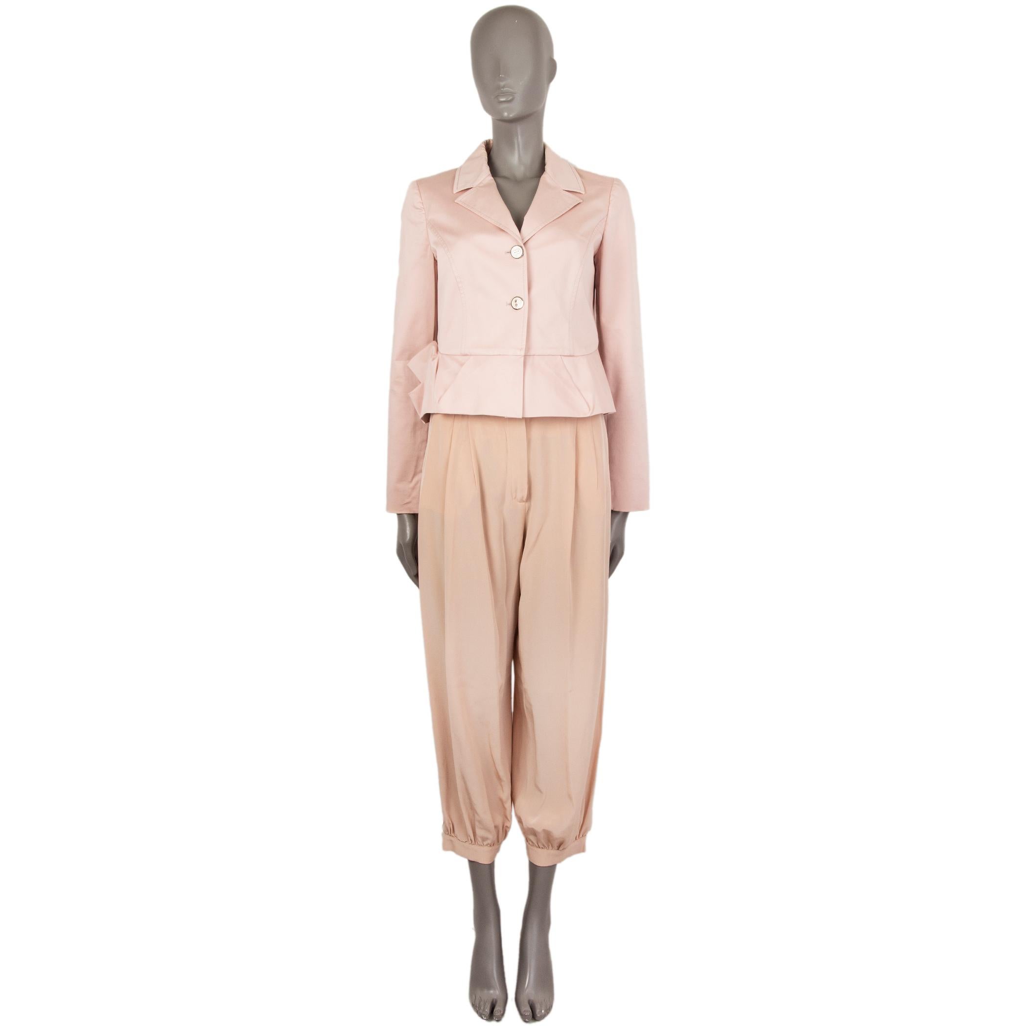100% authentic RED Valentino notch-collar blazer in rose cotton (97%) and elastane (3%). With pleated flute hemline and buttoned cuffs. CLoses with silver and nude enamel buttons on the front. Lined in salmon acetate (67%) and polyester (33%). Has