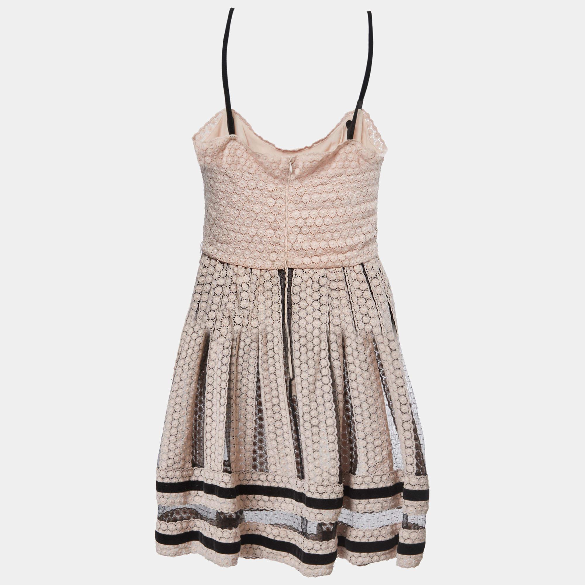 This designer dress is a chic and stylish garment that exudes elegance and sophistication. With its sleek design flattering silhouette and high quality craftsmanship this dress is perfect for any special occasion or evening event ensuring you stand