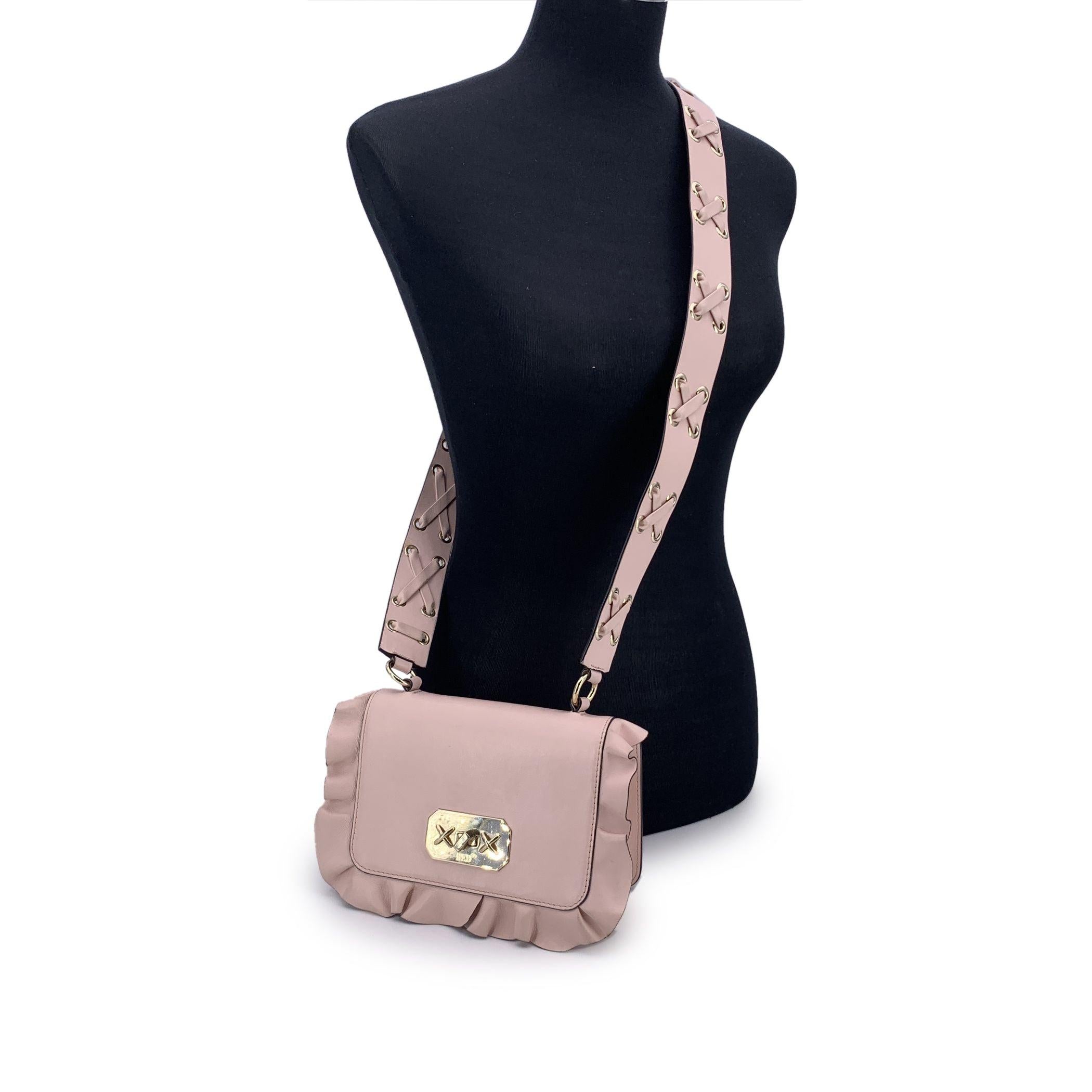 Delicate yet confident, this Red Valentino Shoulder Bag is a graceful statement piece, blending romance with refined design. Made from soft pink leather, it features charming ruffle accents that ripple along its edges like a couture whisper -