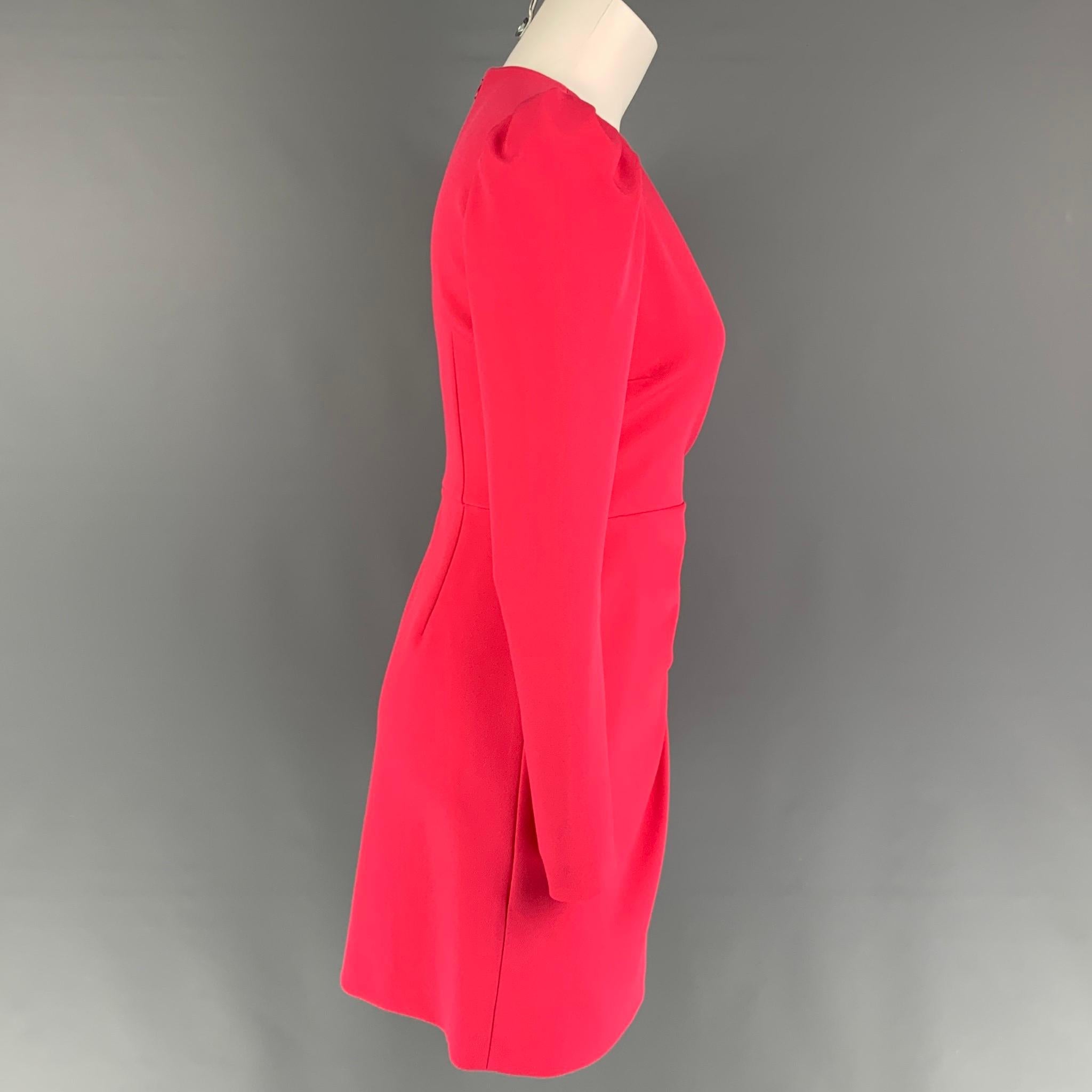 RED VALENTINO dress comes in a coral polyester featuring a wrap style, zipped sleeves, mini length, and a back zip up closure. Made in Romania. 

Very Good Pre-Owned Condition.
Marked: 38

Measurements:

Shoulder: 13 in.
Bust: 34 in.
Waist: 26