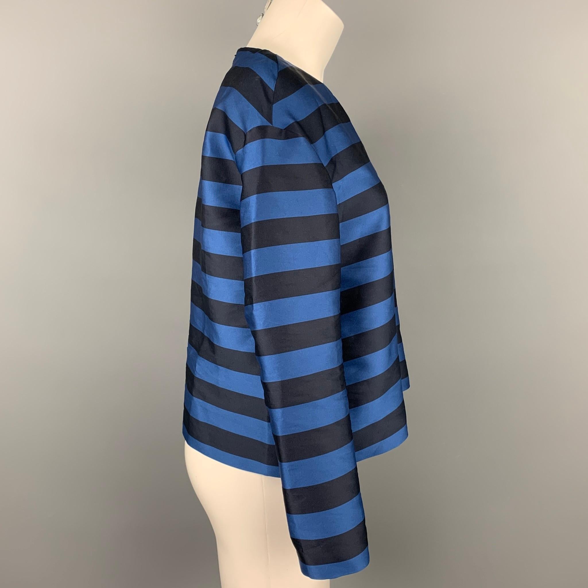 RED VALENTINO dress top comes in a navy & black stripe polyester / silk featuring a crew-neck and a back zip up closure. 

Very Good Pre-Owned Condition.
Marked: 40

Measurements:

Shoulder: 19 in.
Bust: 38 in.
Sleeve: 19.5 in.
Length: 21 in. 