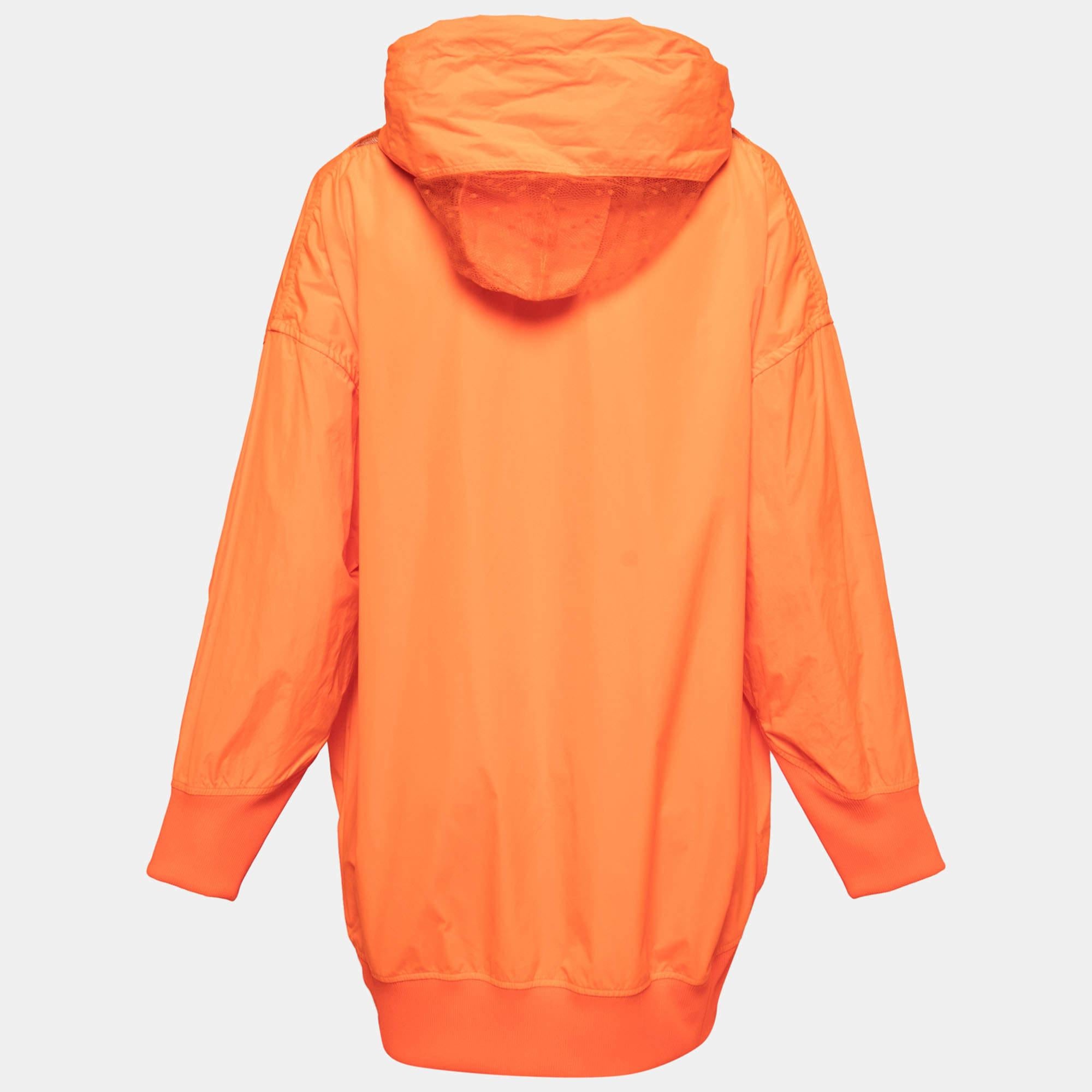 The RED Valentino Neon Orange Taffeta Zip Front Hooded Coat is a vibrant and stylish outerwear piece. Made from taffeta fabric, it features a zip front closure and a hood for added functionality. With its eye-catching neon orange color, this coat is