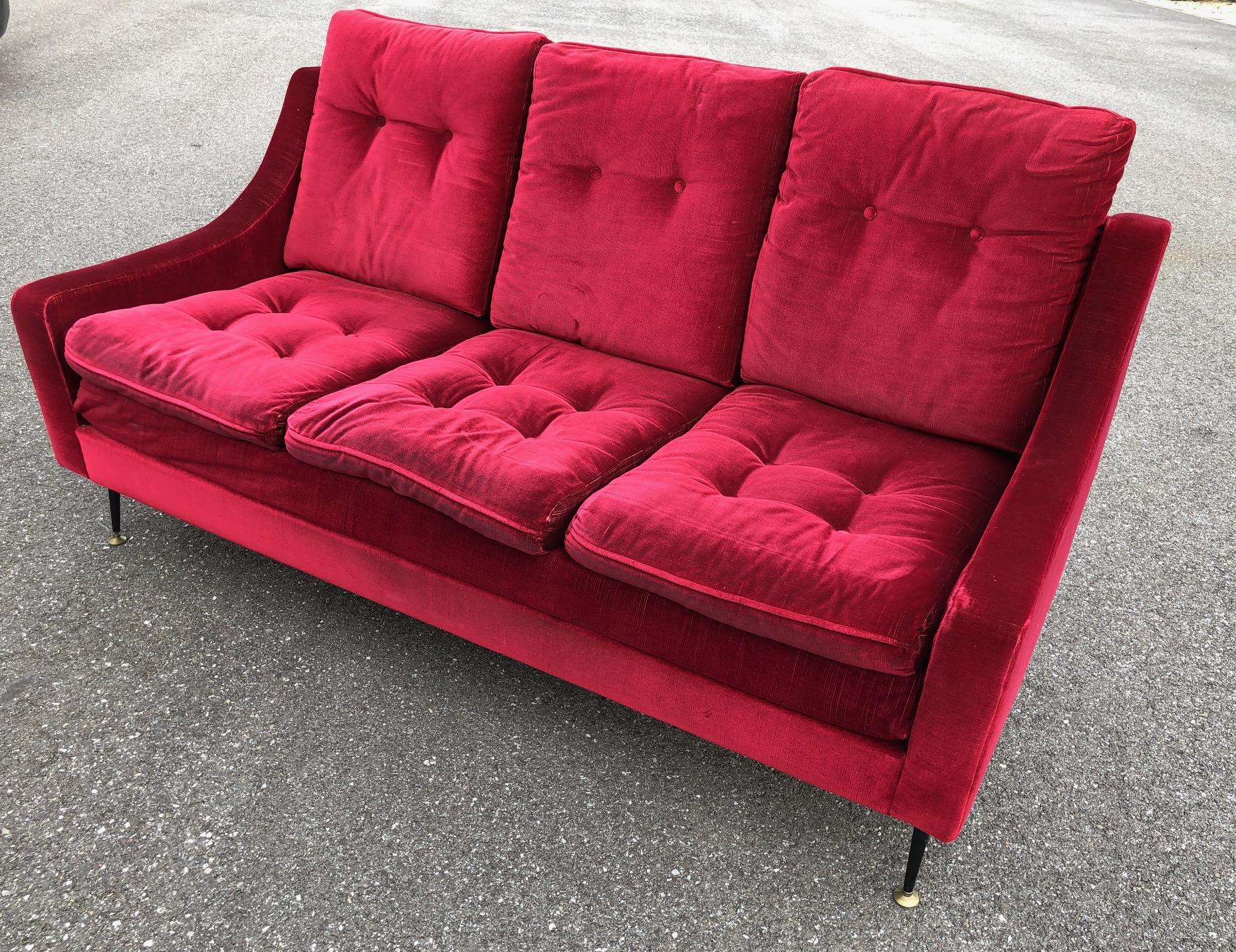 Comfortable sofa with a typical metal base from the 1950s.
 