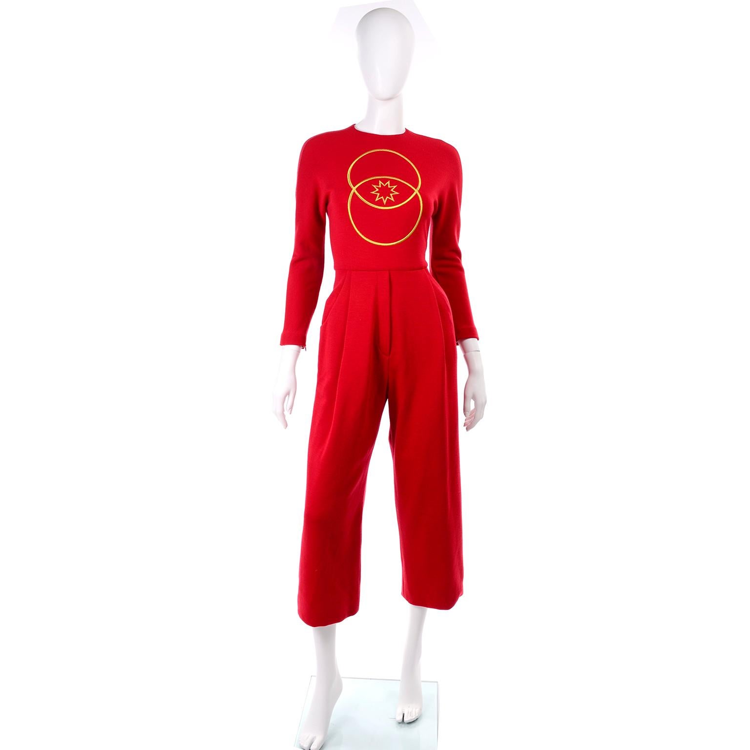 This is a fun vintage Geoffrey Beene jumpsuit in a red wool jersey knit.  This 1980's cropped wide leg jumpsuit has pockets at the pleated waist and long sleeves with zippers at the cuffs.  There is a center back zip closure and gold embroidery on