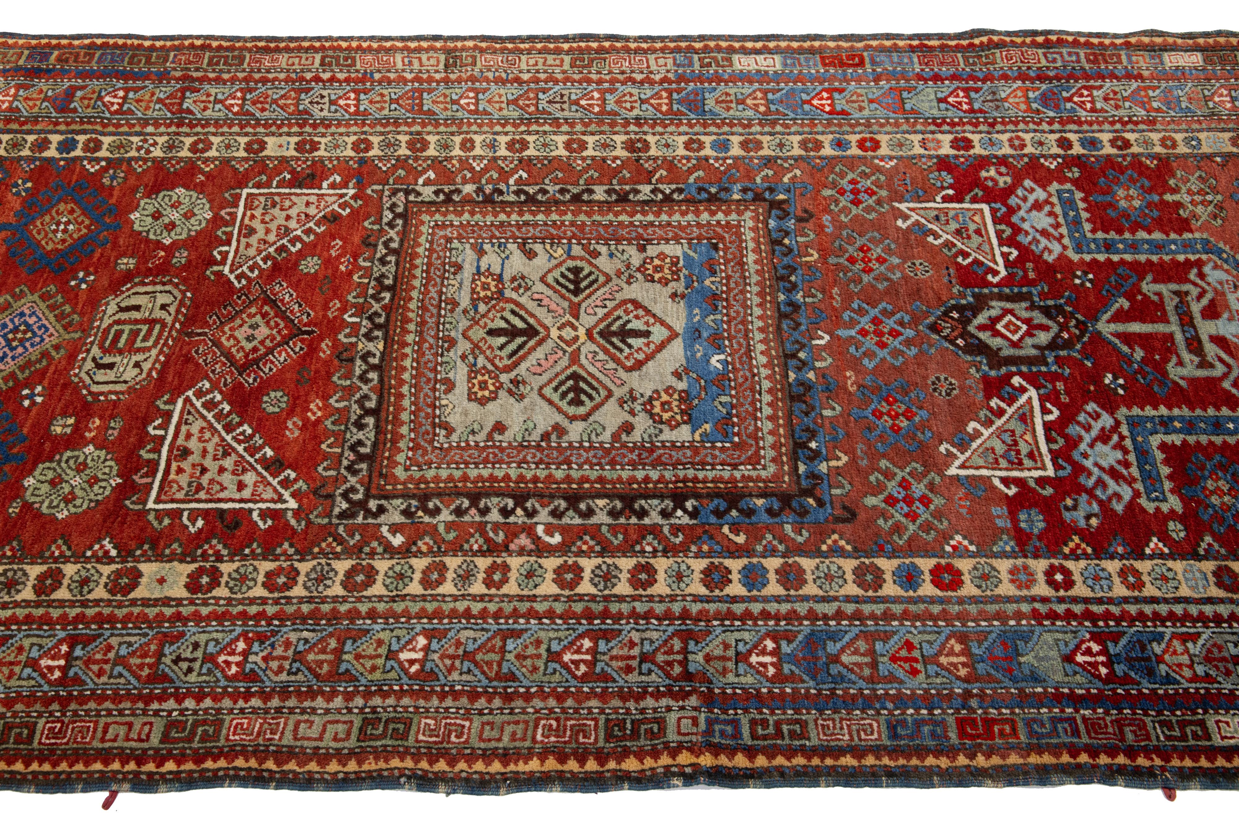 Early 20th Century Red Vintage Caucasian Kazak Wool Rug With Geometric Pattern For Sale