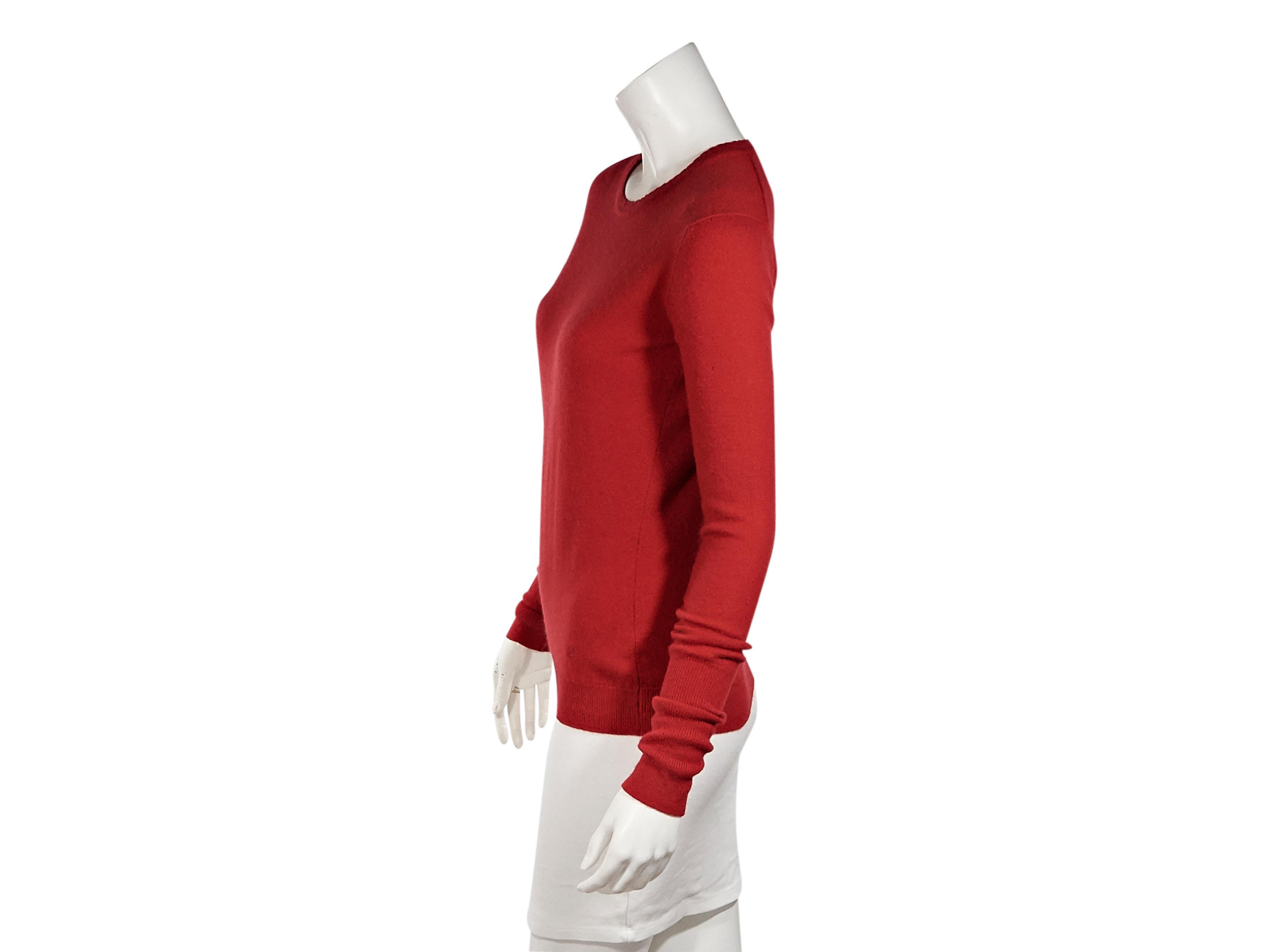 Product details:  Vintage red cashmere sweater by Chanel.  Roundneck.  Long sleeves.  Ribbed cuffs and hem.  Pullover style.  32