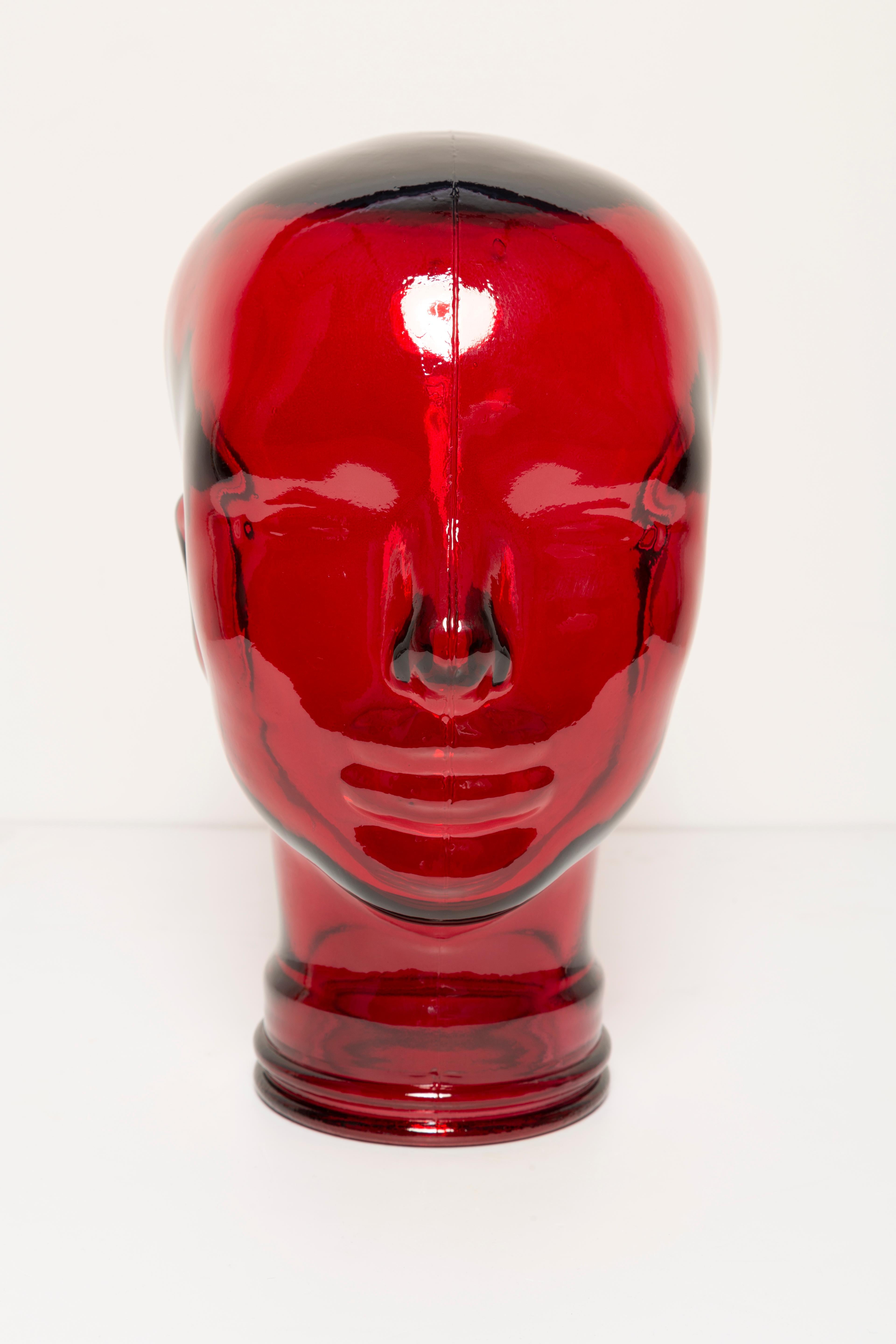 Life-size glass head in a unique red color. Produced in a German steelworks in the 1970s. Perfect condition. A perfect addition to the interior, photo prop, display or headphone stand.