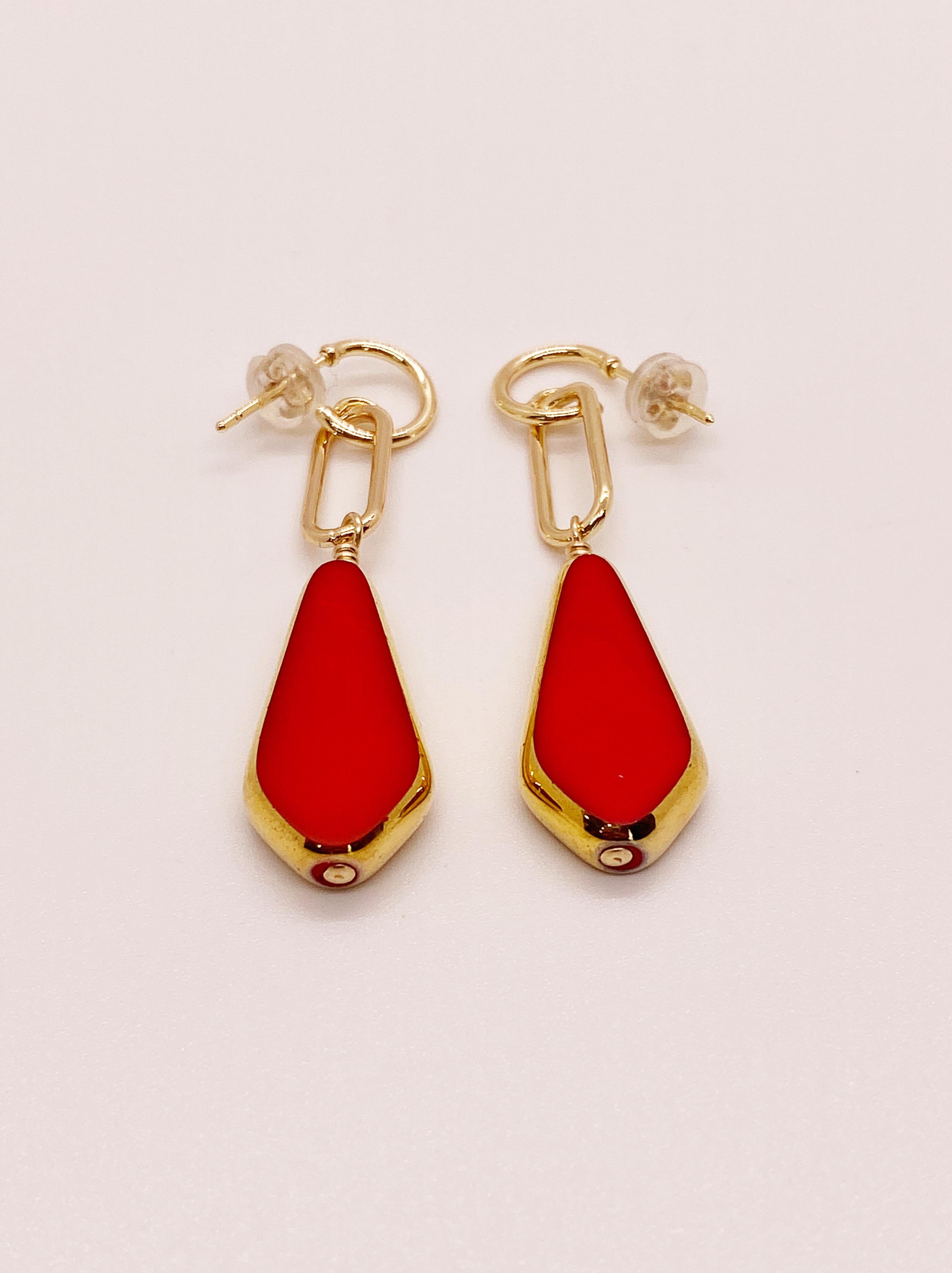Red German vintage glass beads edged with 24K gold dangles on a 14K gold filled ear finding. 

The German vintage glass beads are considered rare and collectible, circa 1920s-1960s.
