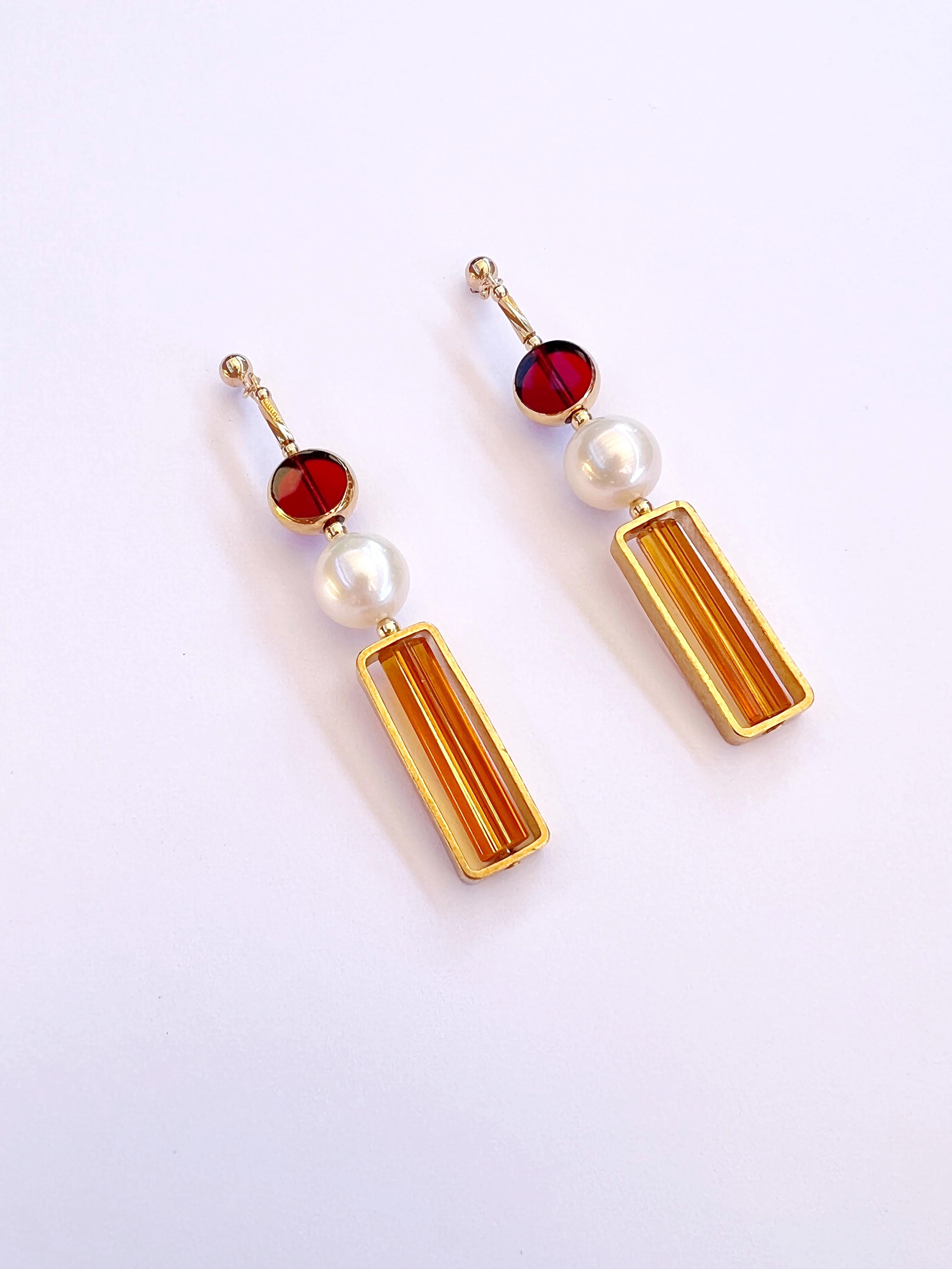 Red transparent vintage German glass beads edged with 24K gold are complimented with freshwater pearls with caramel glass bugle bead. The earrings are finished with gold filled earring post and 14K gold filled beads.

The vintage German glass beads