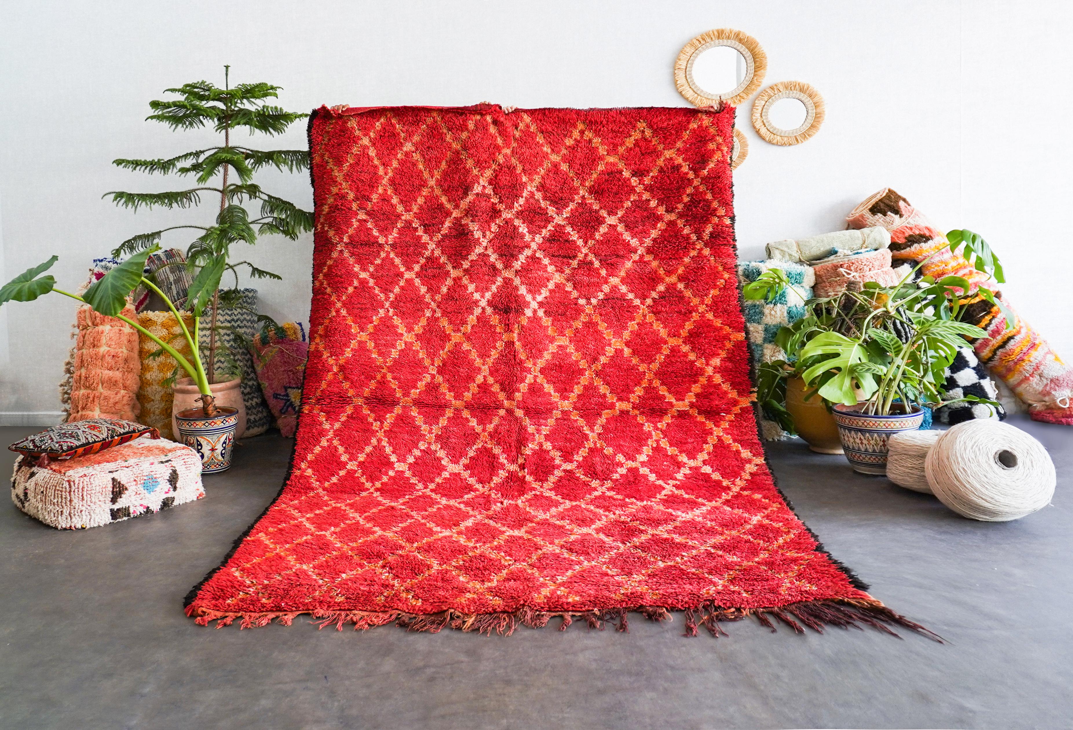 Uncover the rich heritage woven into our red Moroccan vintage rug. Handmade by skilled artisans using time-tested techniques, each Berber rug is a unique narrative, echoing the cultural tapestry of Morocco. With intricate geometric patterns and a