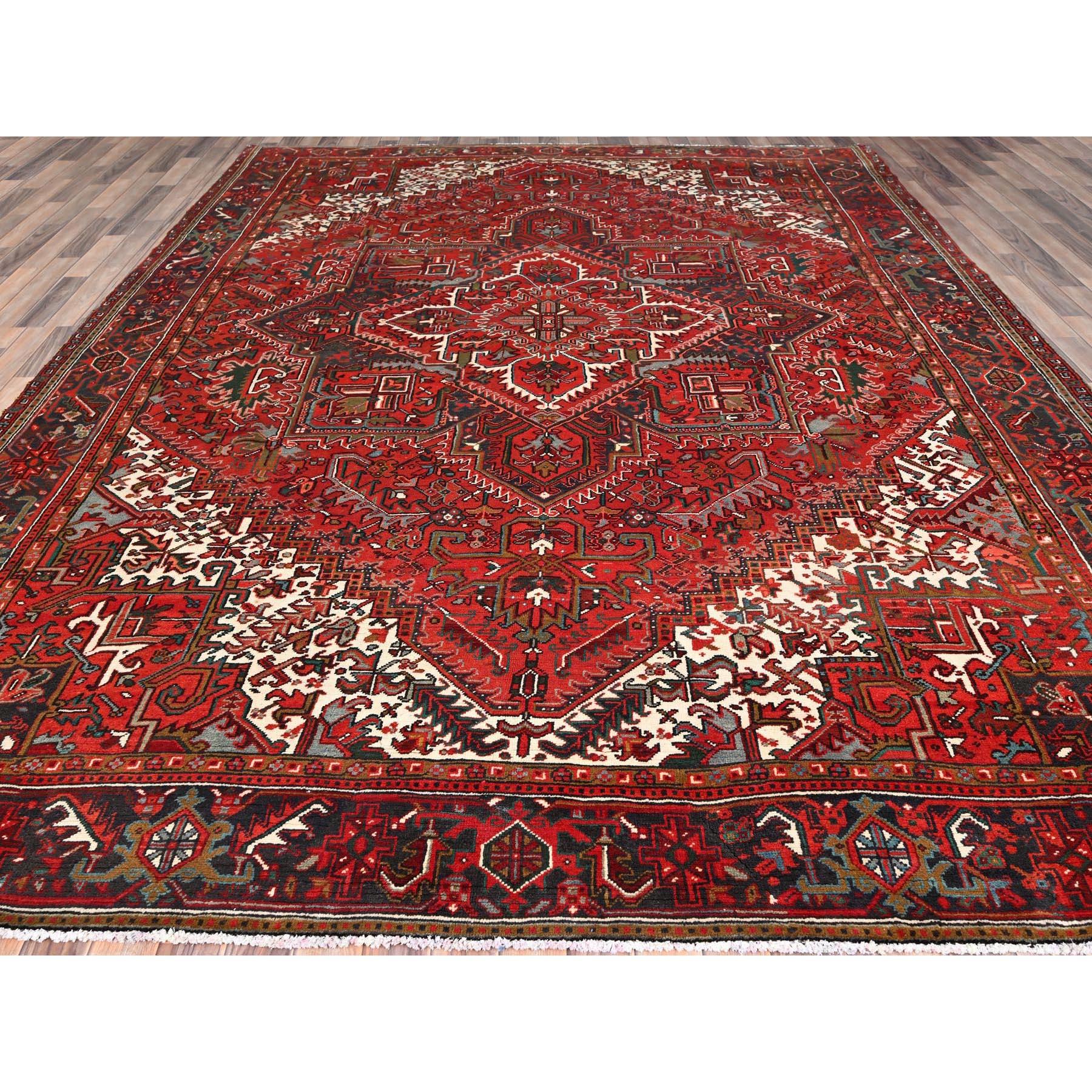 Hand-Knotted Red Vintage Persian Heriz Good Condition Rustic Feel Worn Wool Hand Knotted Rug For Sale
