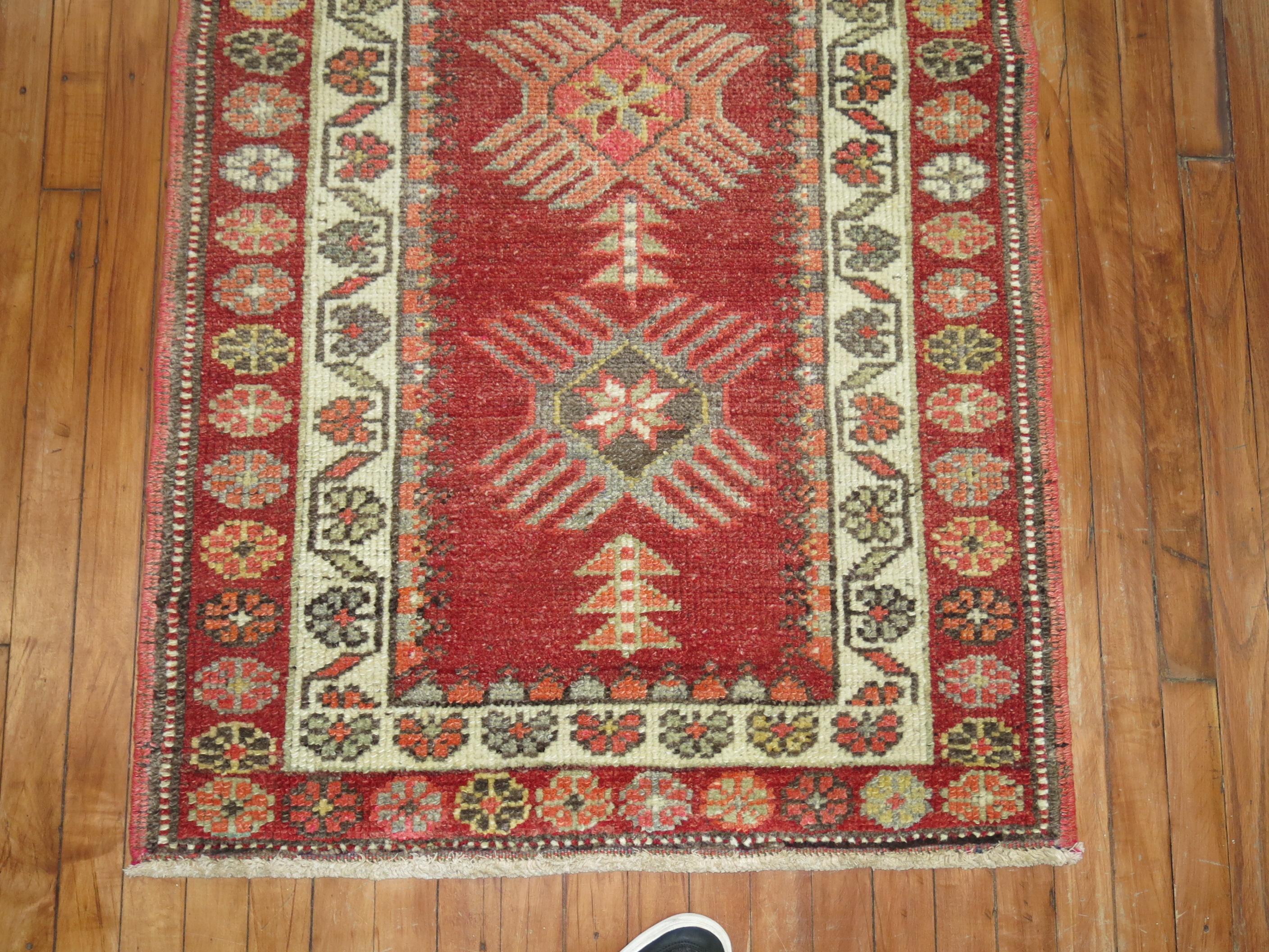 Narrow and long vintage Turkish Anatolian runner in a deep red tone.

Measures: 2'11
