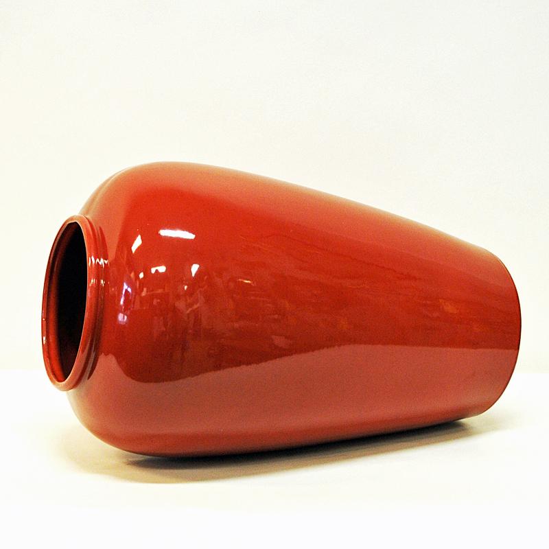 This large and red vintage vase was produced under the 1970s by Scheurich in West Germany. It is stamped underneath with W. Germany 504-48. The vase is in good vintage condition.
Measures: 48 cm H x 28cm D. Opening on top 17 cm D. West German art