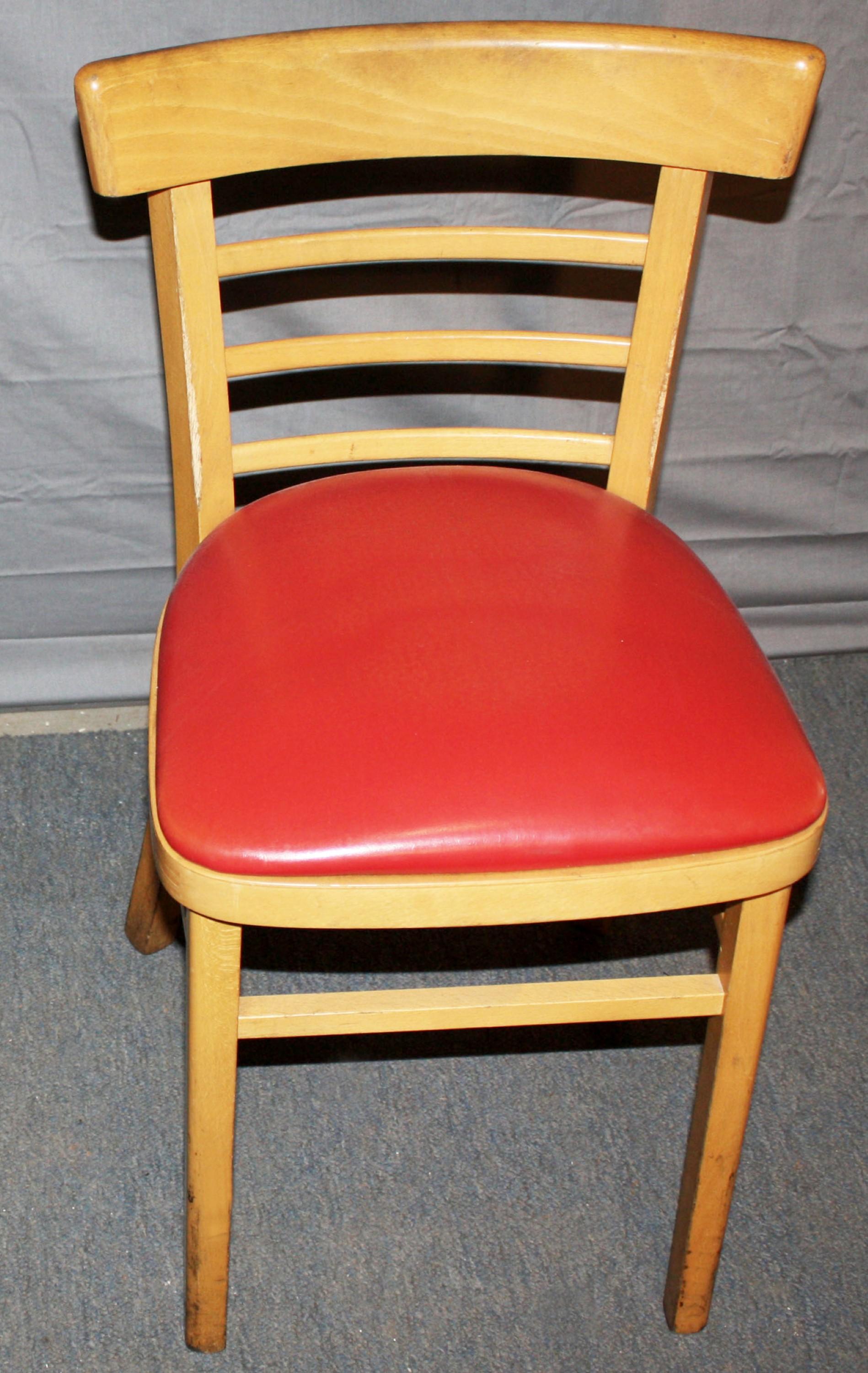 Chair made of light tone maple with a red vinyl seat. Small quantity available at time of posting. Please inquire. Priced each. Please note, this item is located in one of our NYC locations.