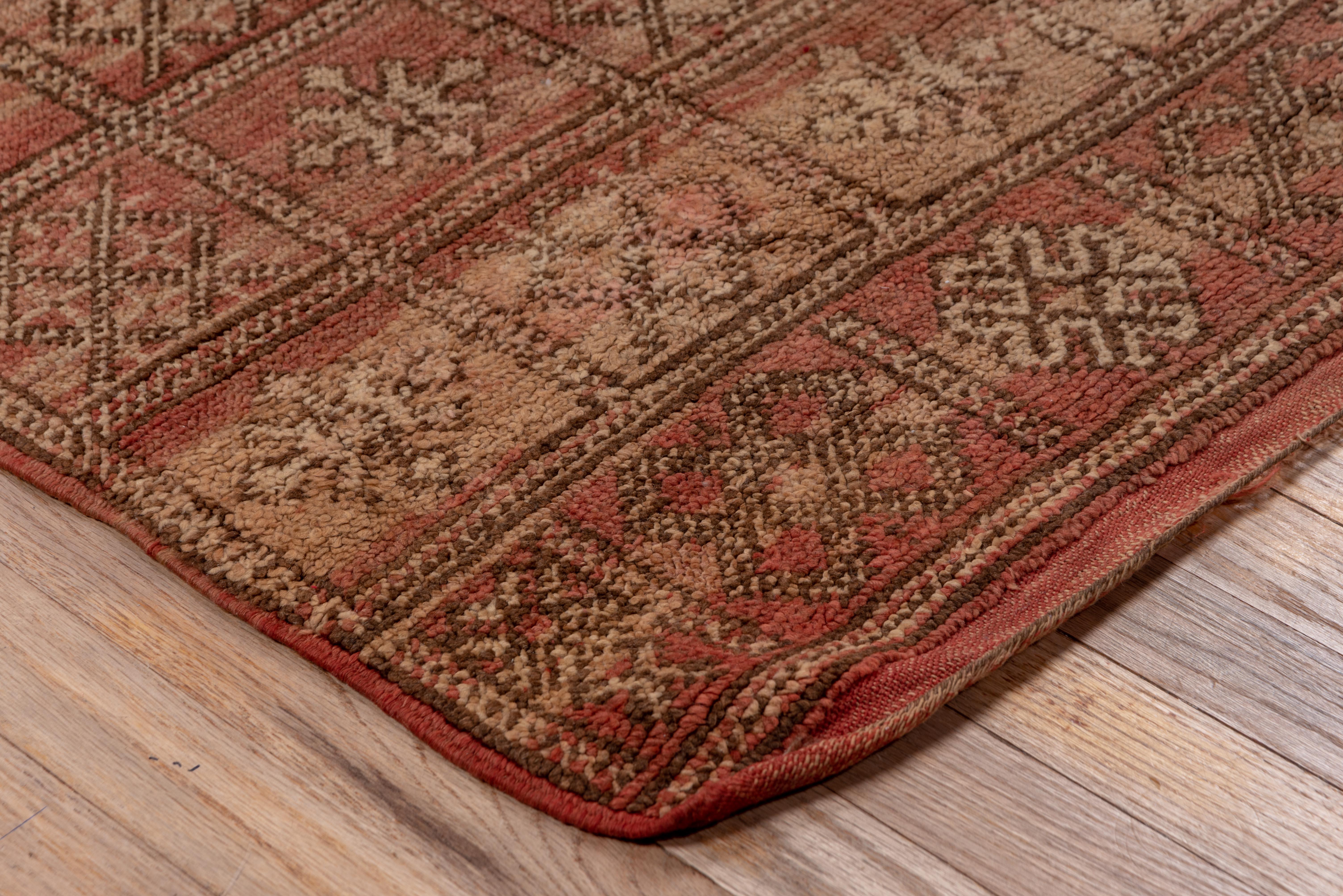 This checkered village rug out of Morocco features diamond snowflake patterns - the red dye remains strong and in tact, showing even more beauty with age